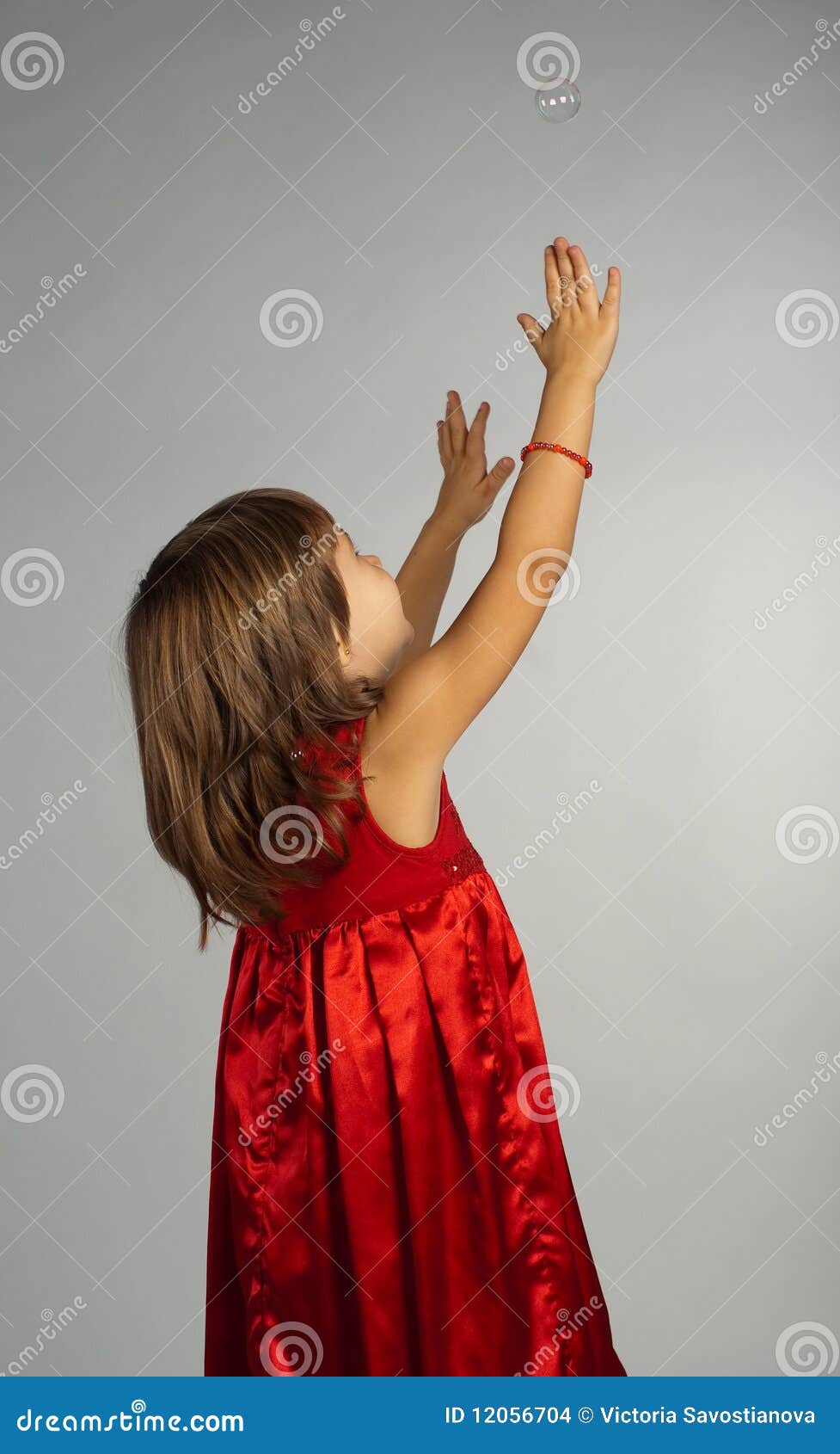 Little Girl In A Red Dress With Hands Up Stock Photo Im