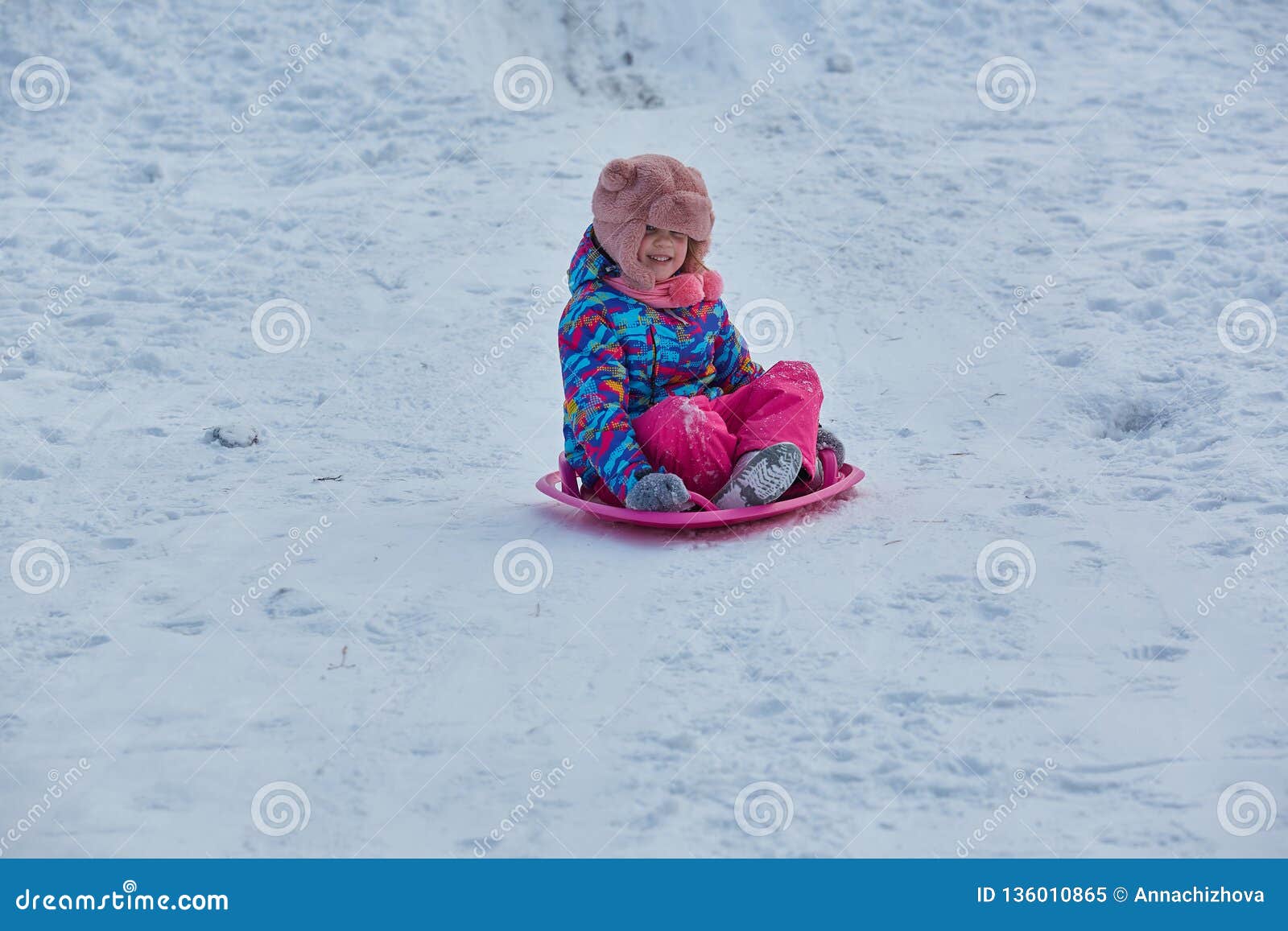 Little Girl Riding on Snow Slides in Winter Time Stock Image - Image of ...