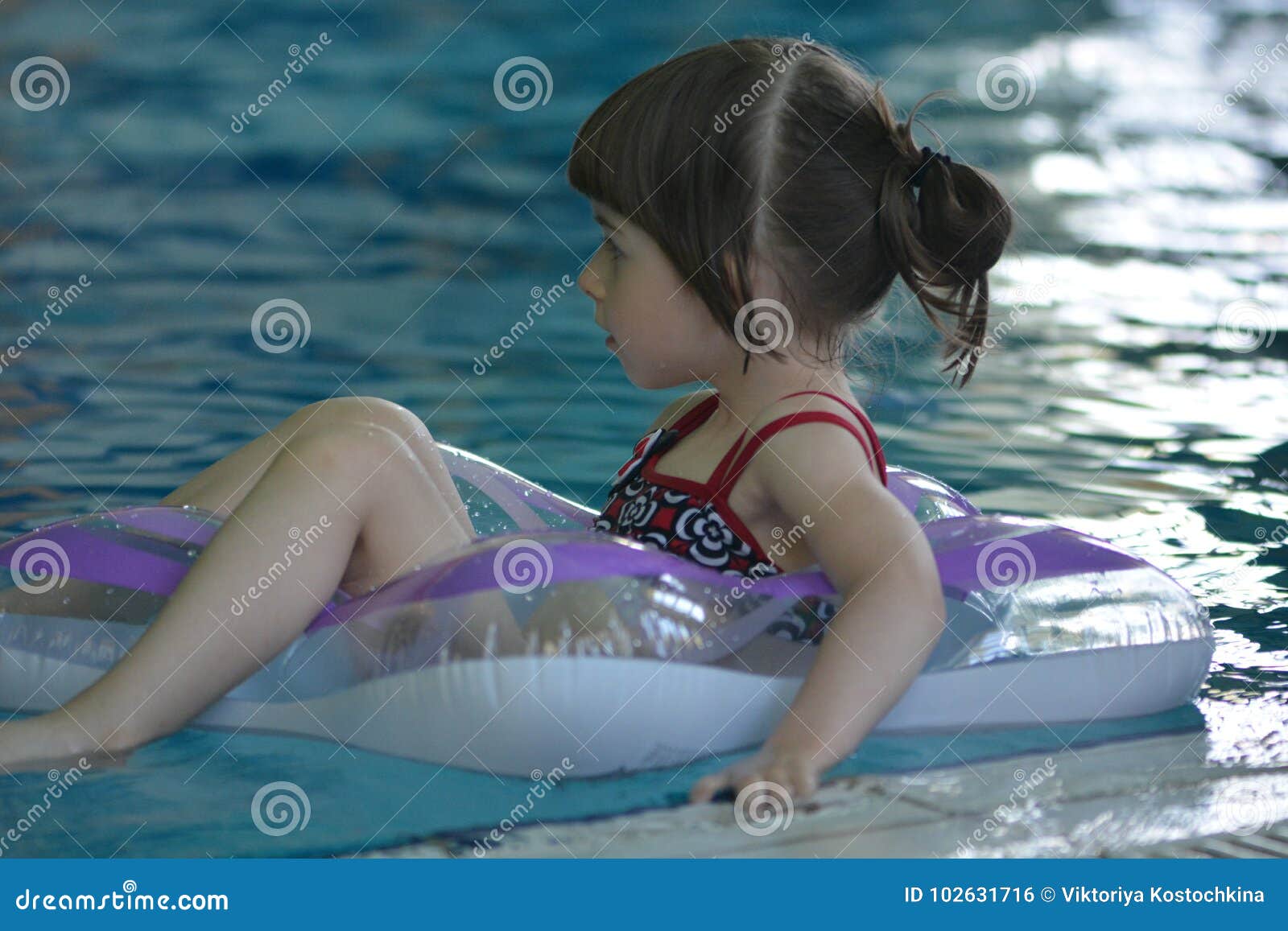Little Girl in a Rubber Ring Stock Photo Image of water, girl 102631716