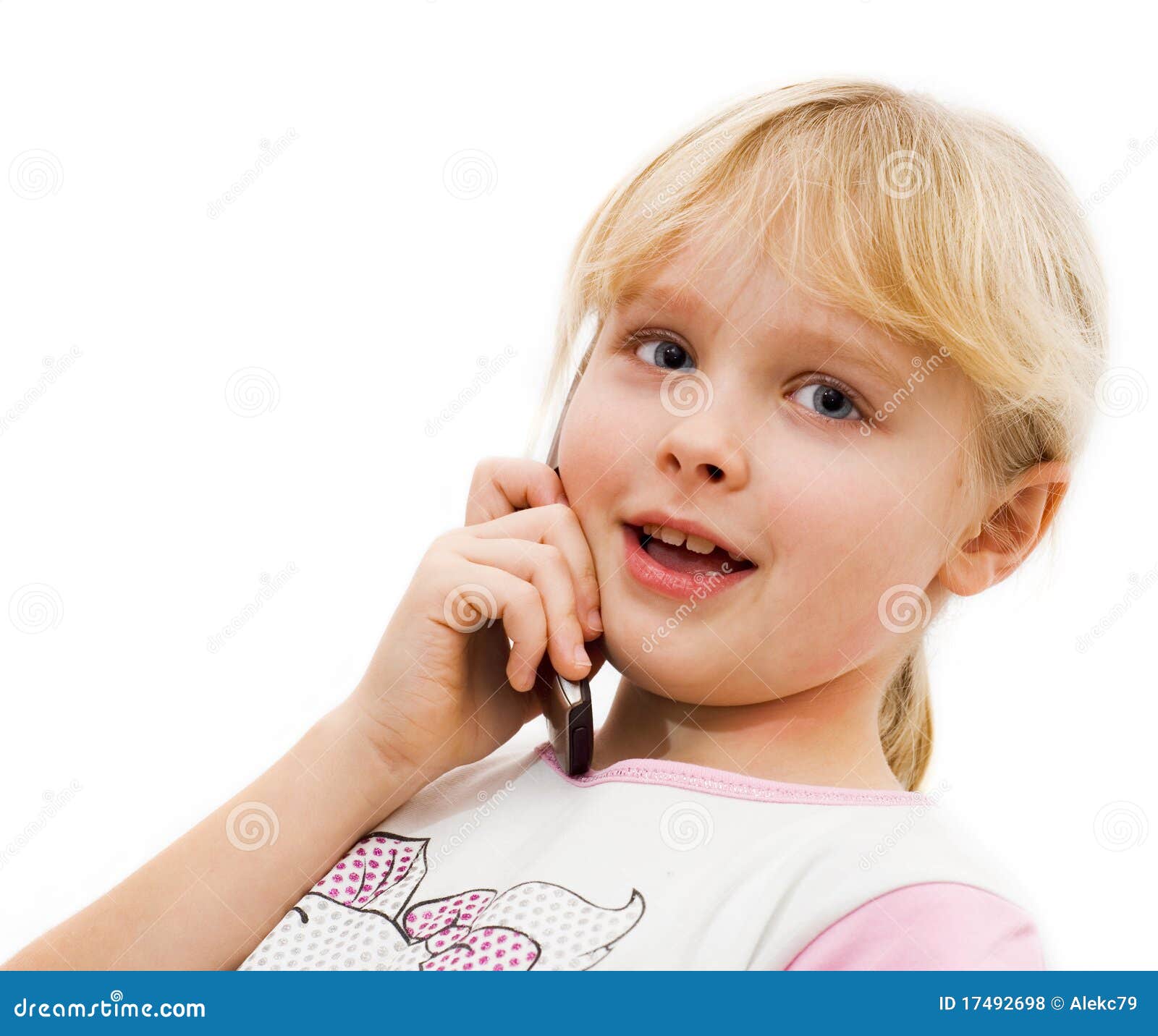 Little Girl Says on a Cell Phone Stock Photo Image of eyes, hair