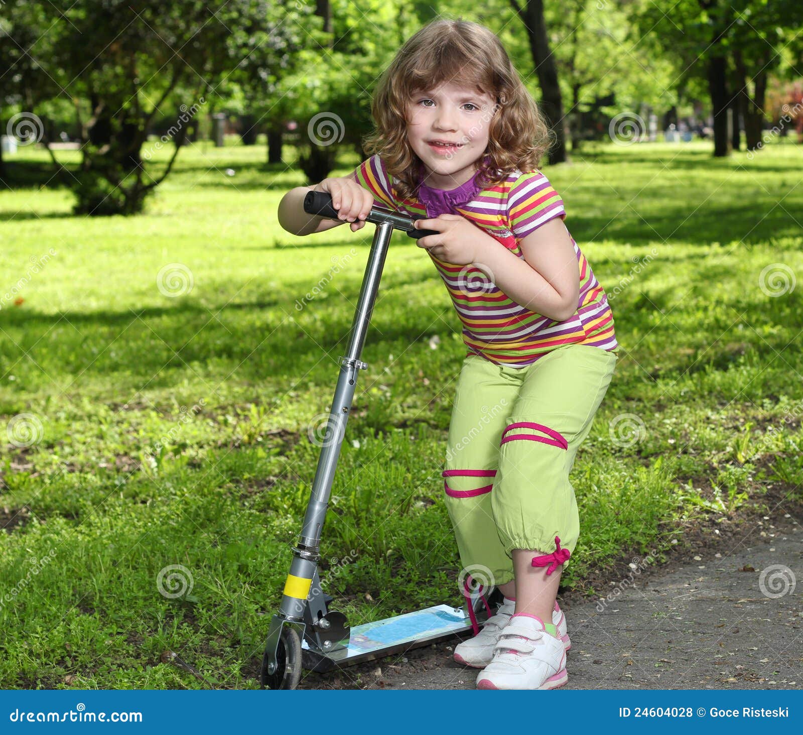 Little girl with scooter stock photo. Image of adorable 24604028