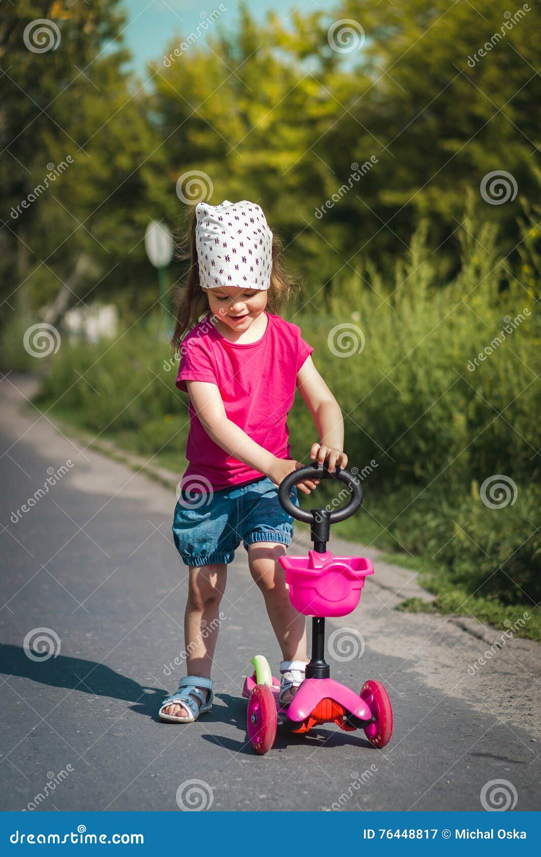 Little girl on scooter stock image. Image of leisure 76448817