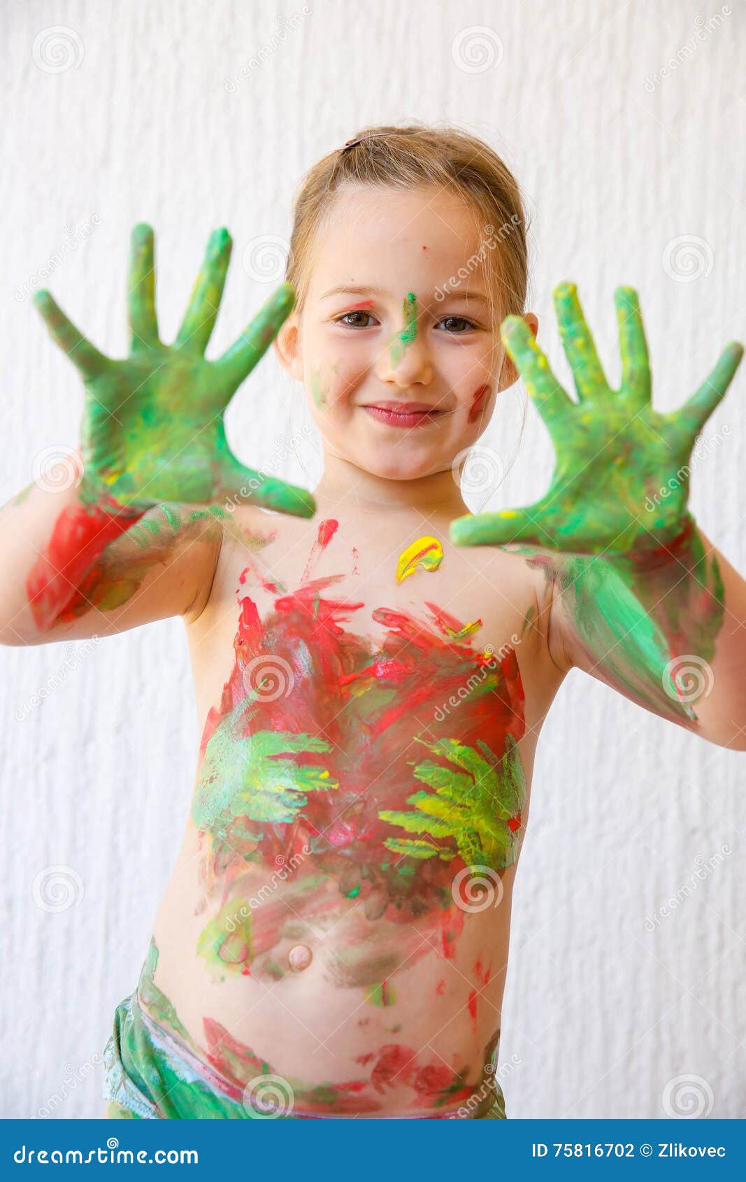 Little Girl Showing Her Hands, Covered In Finger Paint Stock Photo