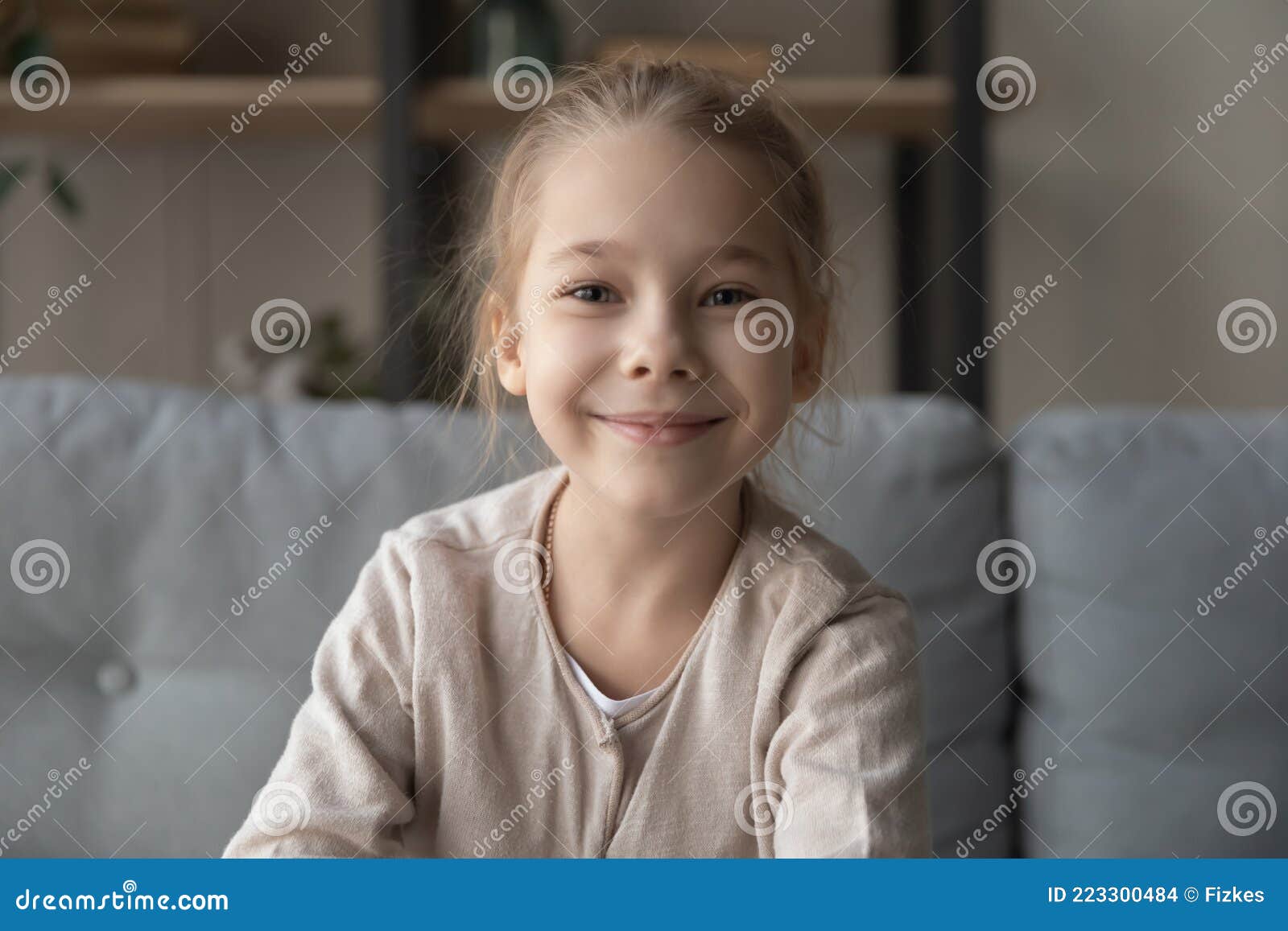 Little Girl Sitting on Couch Looking at Camera Making Videocall Stock Photo  - Image of chat, people: 223300484