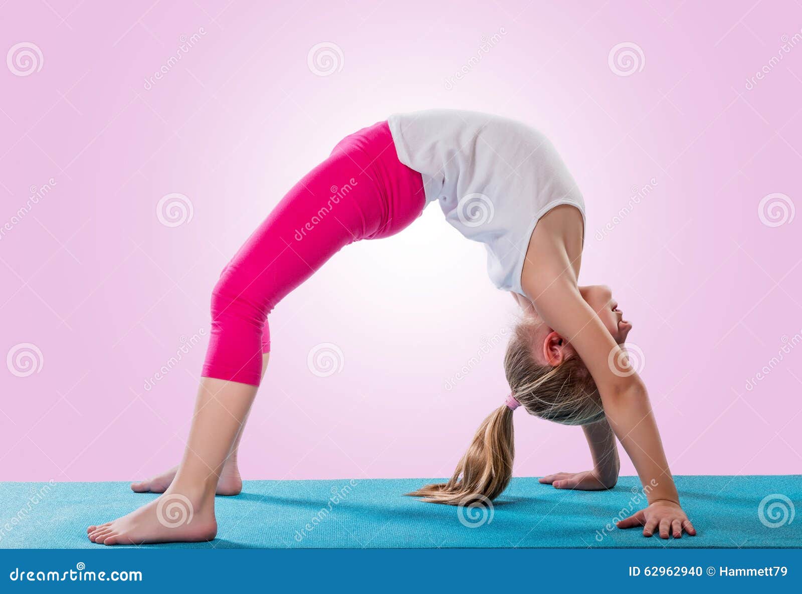 middle aged woman yoga asanas. instructor shows a pose from yoga. woman  practicing yoga Stock Photo by yavdat