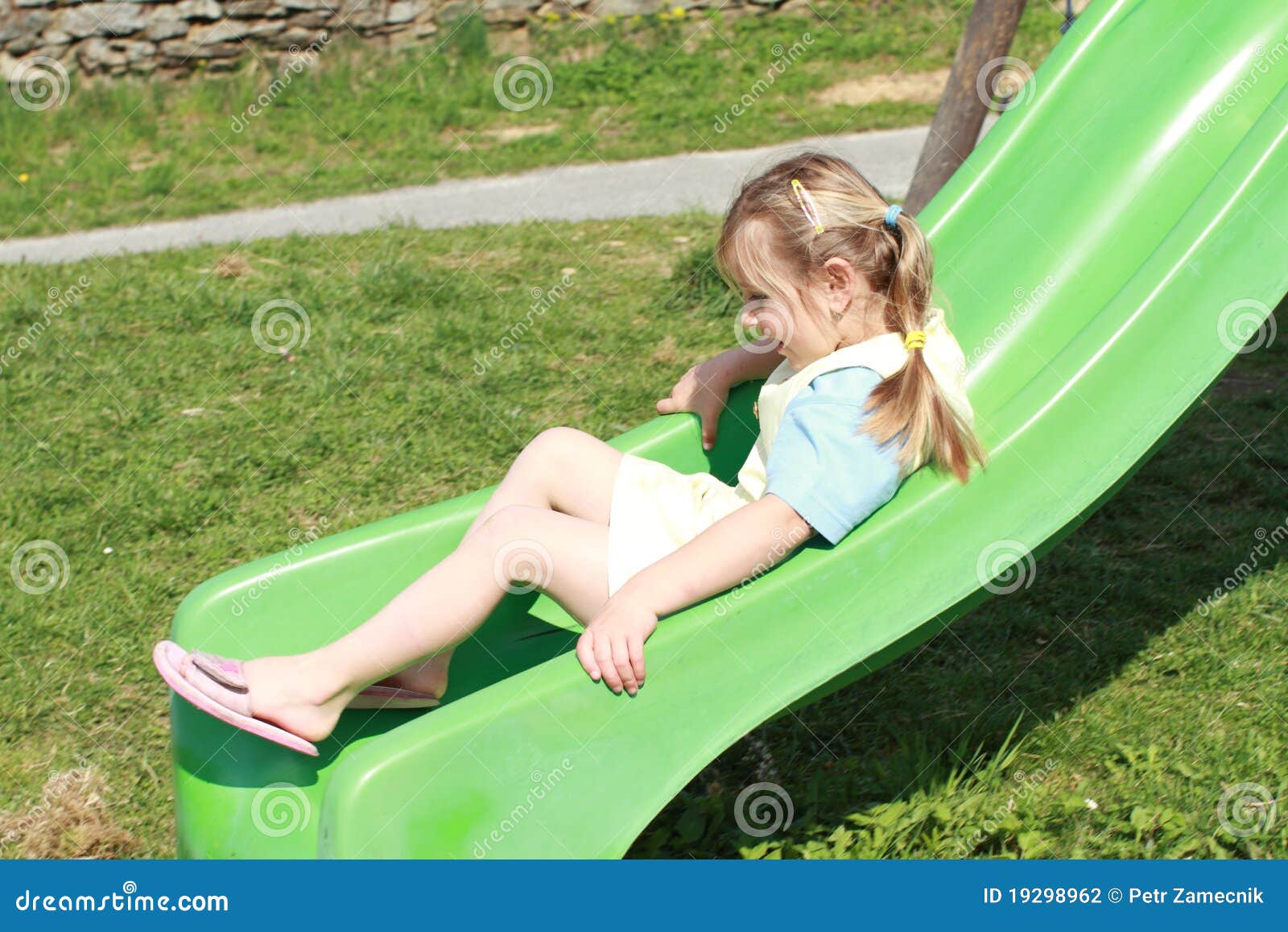 Little girl on slide stock photo. Image of smile, grass 19298962