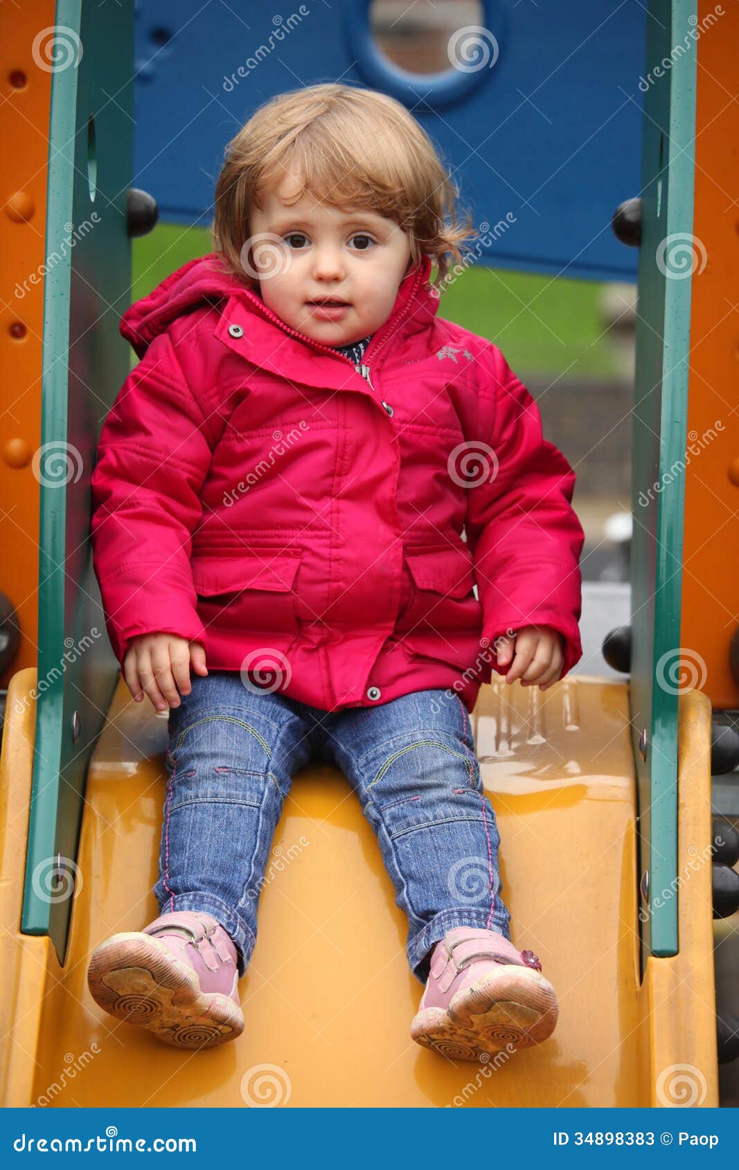 Little girl on a slide stock image. Image of amusement 34898383