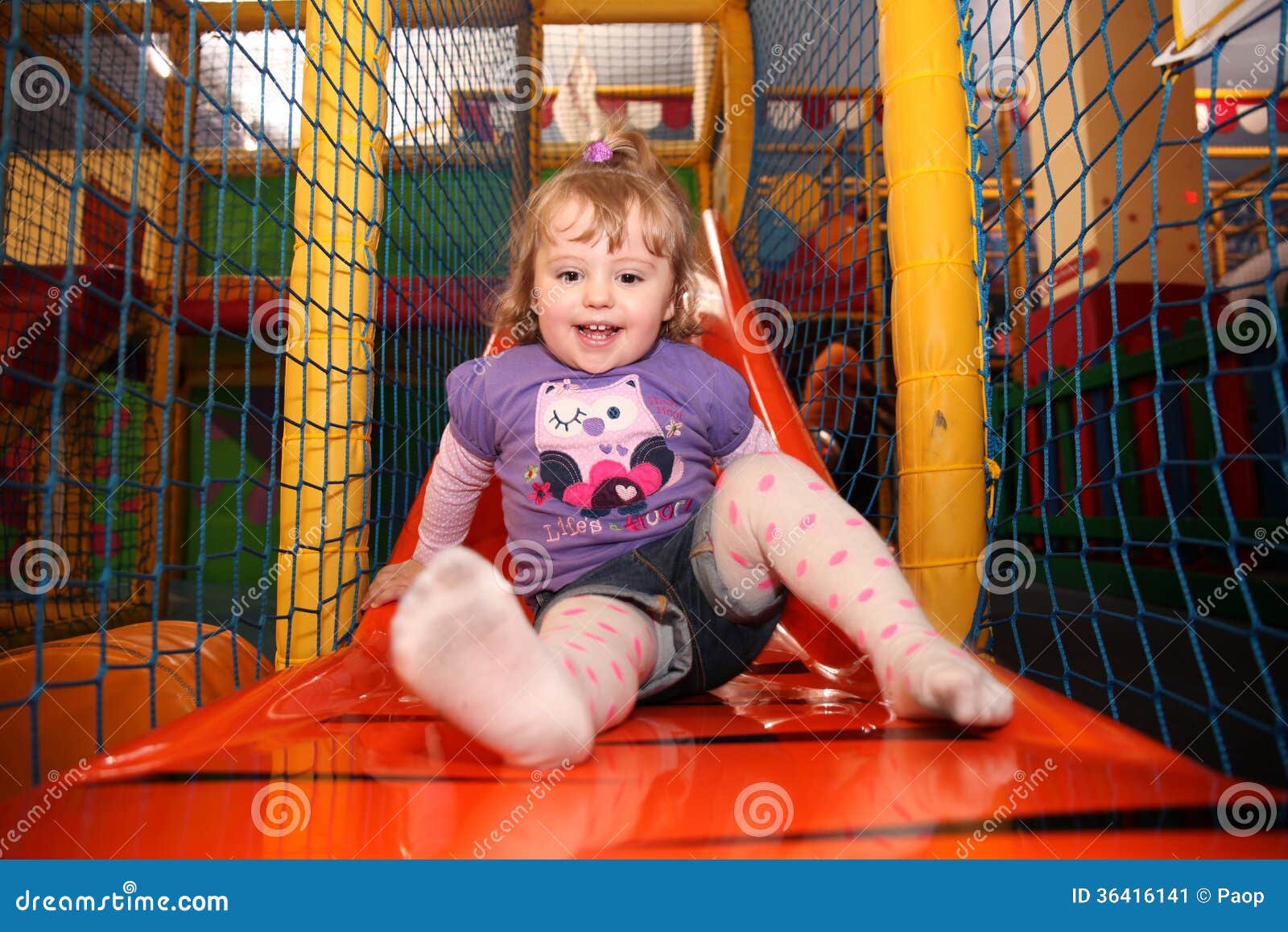 Little girl on a slide stock image. Image of expression 36416141