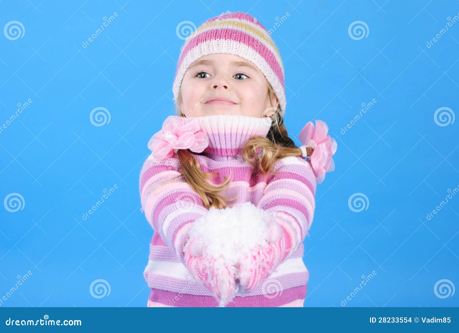 Little Girl in a Sweater and a Hat with the Snow Stock Photo Image of