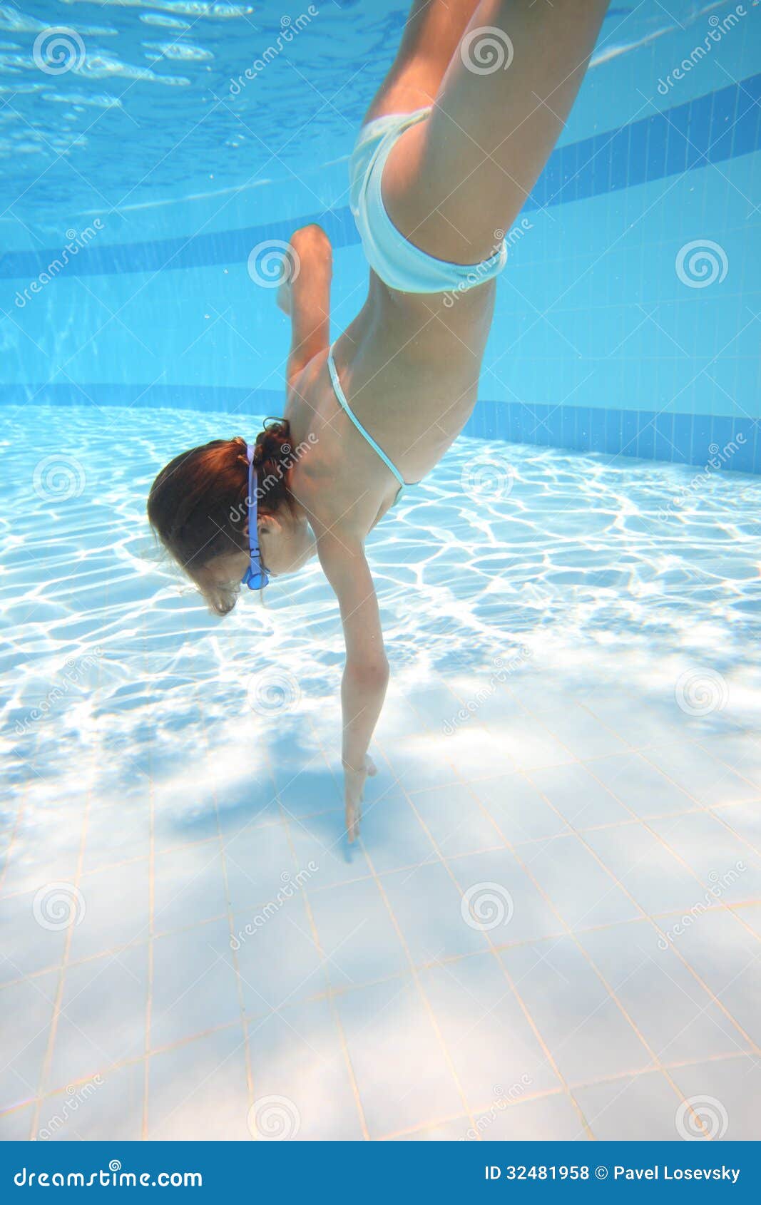 Little Girl in Swimming Goggles Swimming Underwater Stock Photo ...