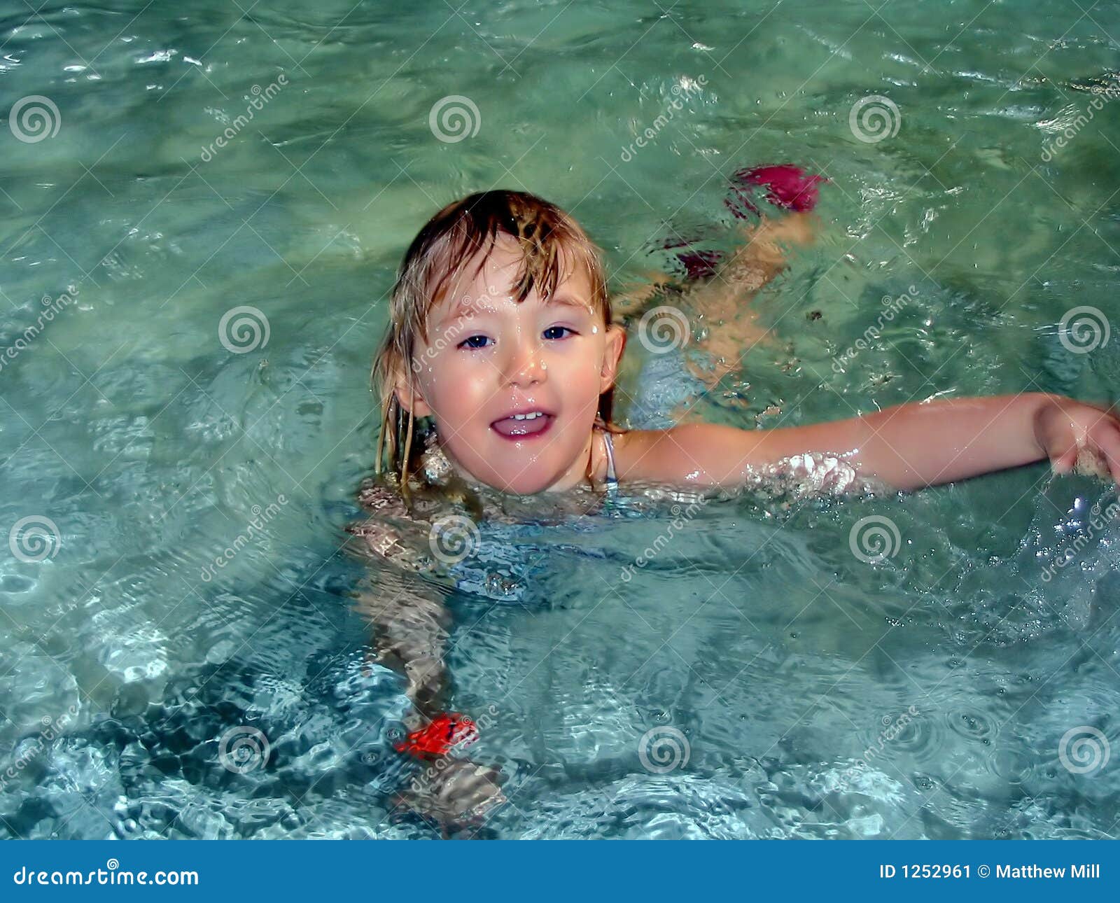 Little Girl Swimming in a Pool Stock Image Image of vacation, splashing 1252961
