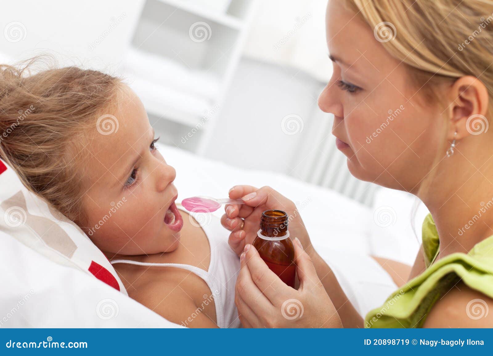 little girl taking medicine