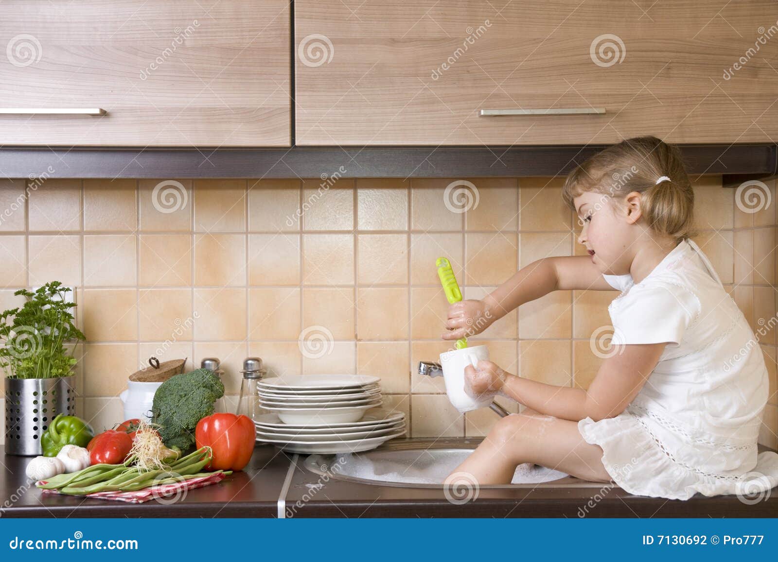 Attractive Young Woman Is Washing Dishes While Doing Cleaning At Home Stock  Photo, Picture and Royalty Free Image. Image 91906745.