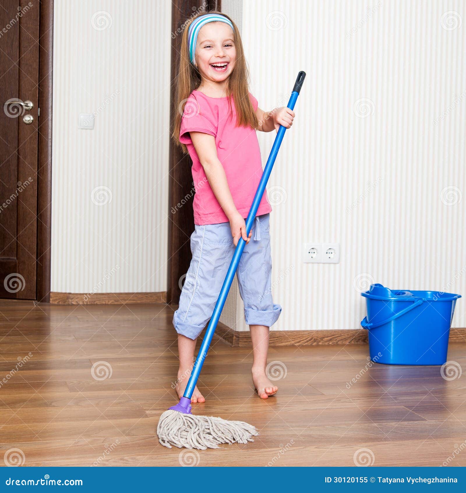 little girl washing floor mop home 30120155