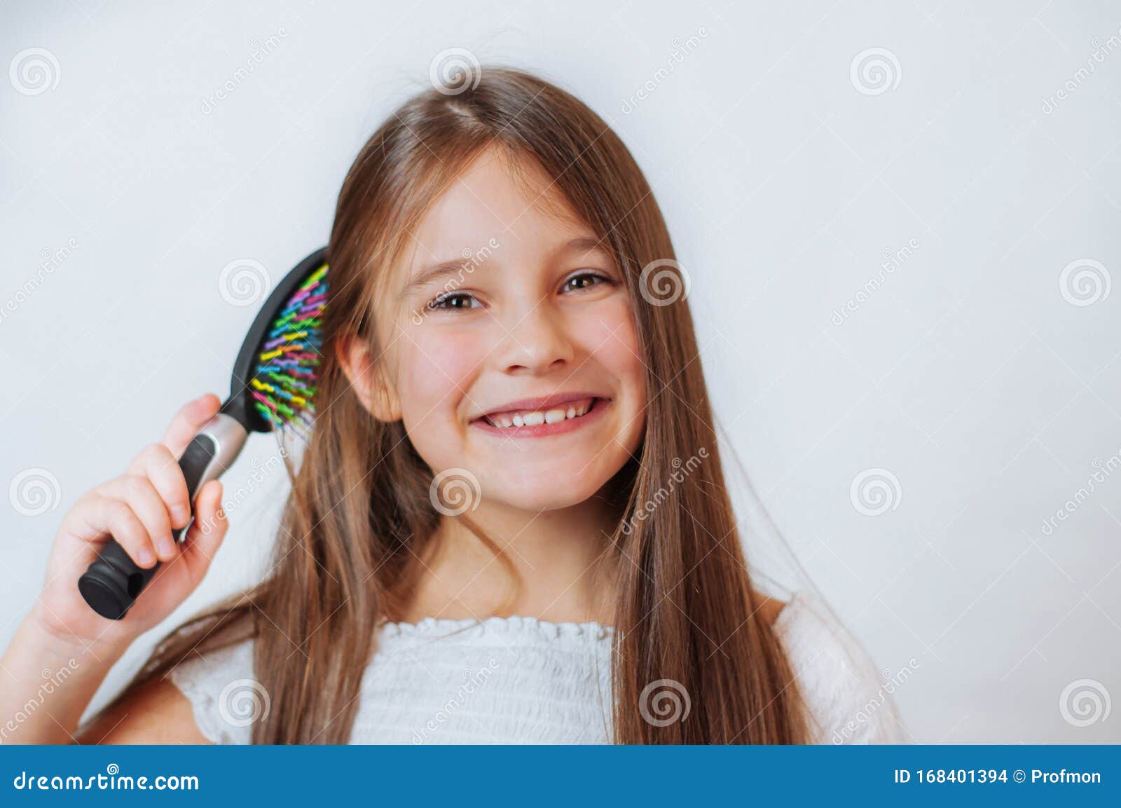 Cute Smiling Little Girl Combing Her Hair Comb Makes Hair Stock Photo ...