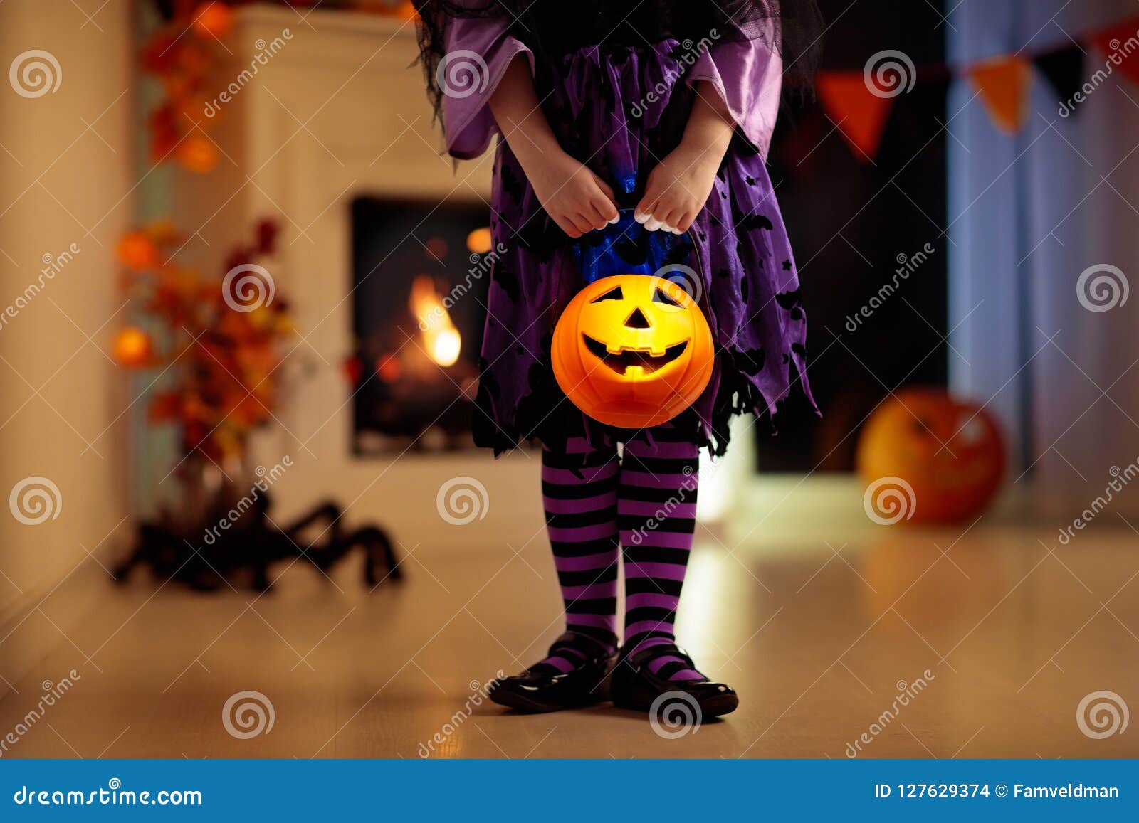 kids in witch costume on halloween trick or treat