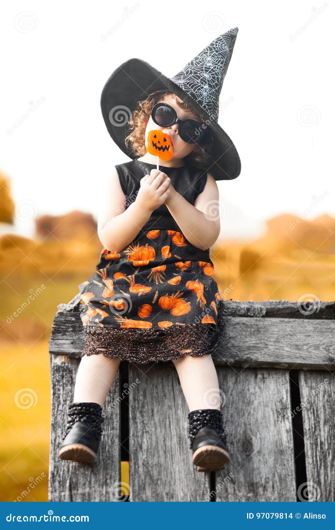 little girl witch sitting on a roof
