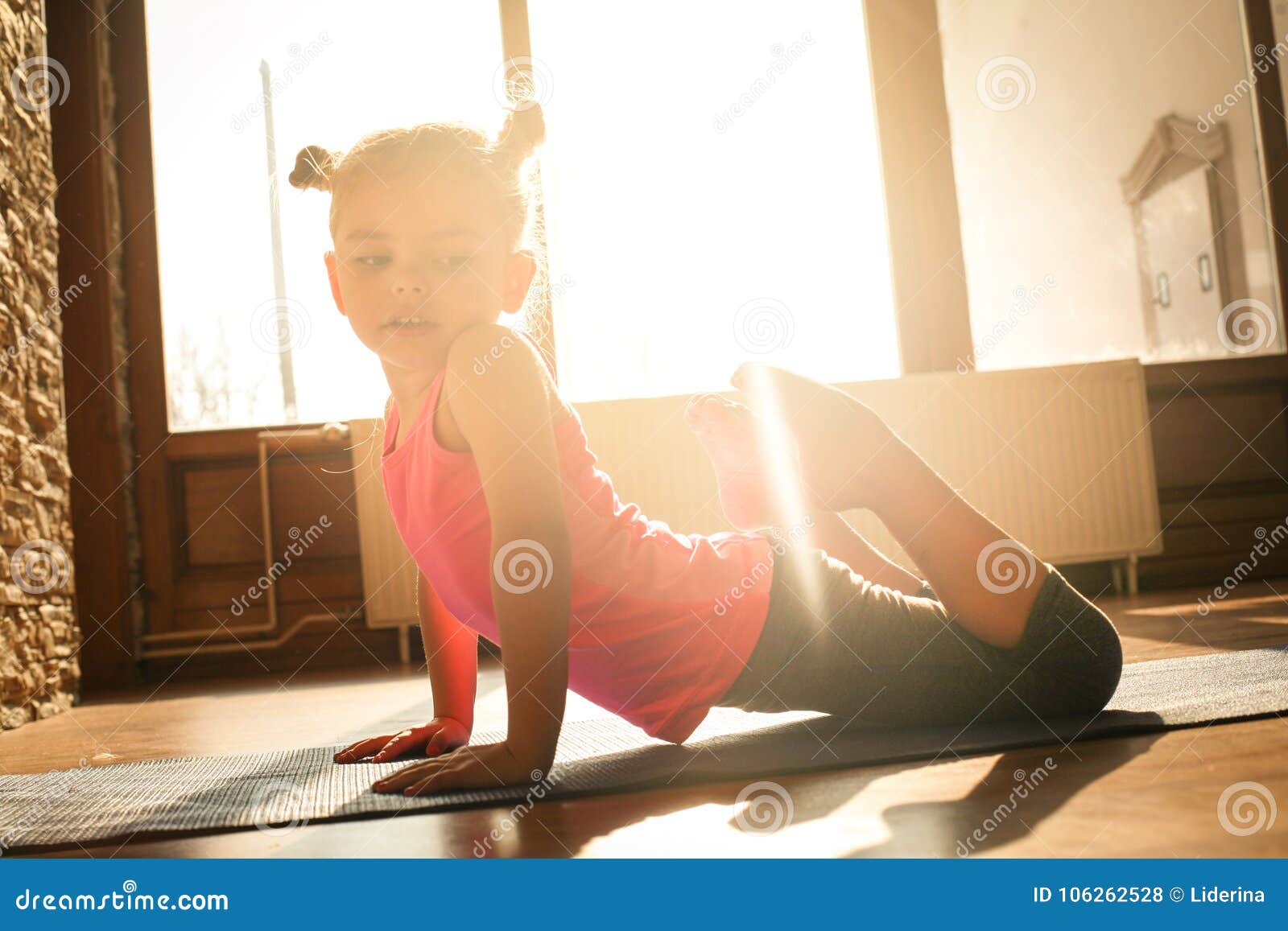 Little Girl Doing Exercise at Home. Stock Photo Image of health
