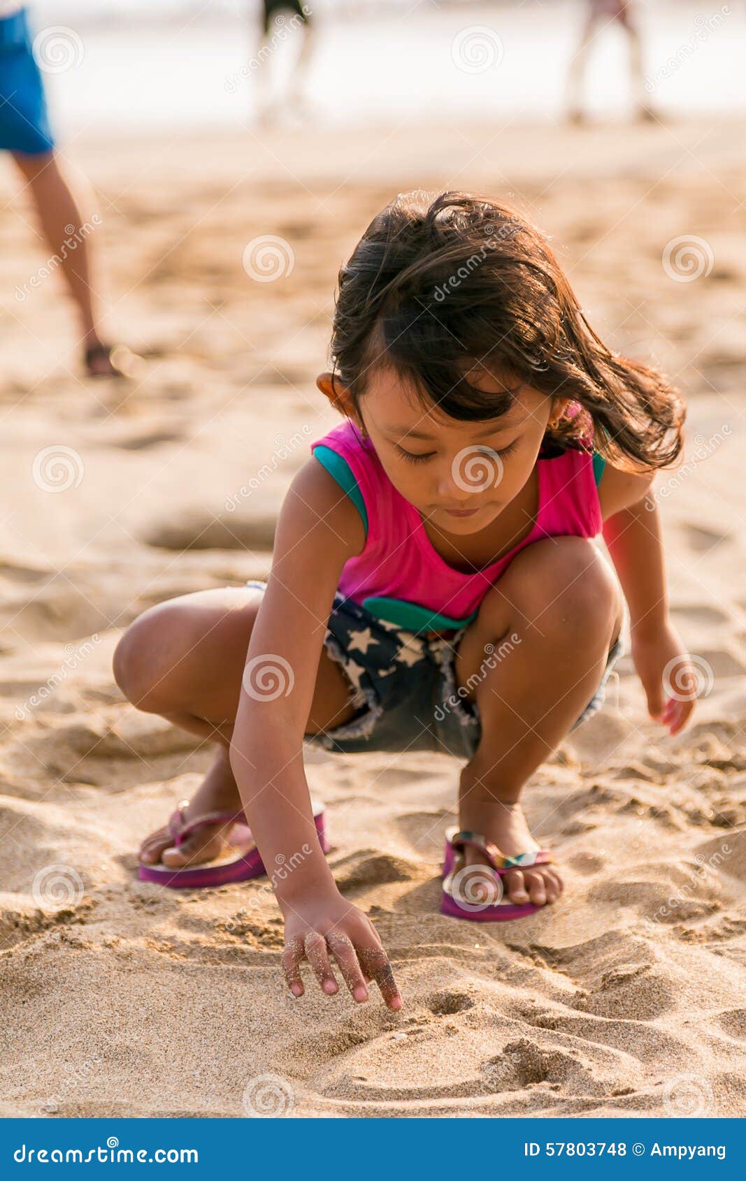 Little Asian Girl Playing On Sunny Beach On A Summer Day Stock Photo - Download Image Now - iStock