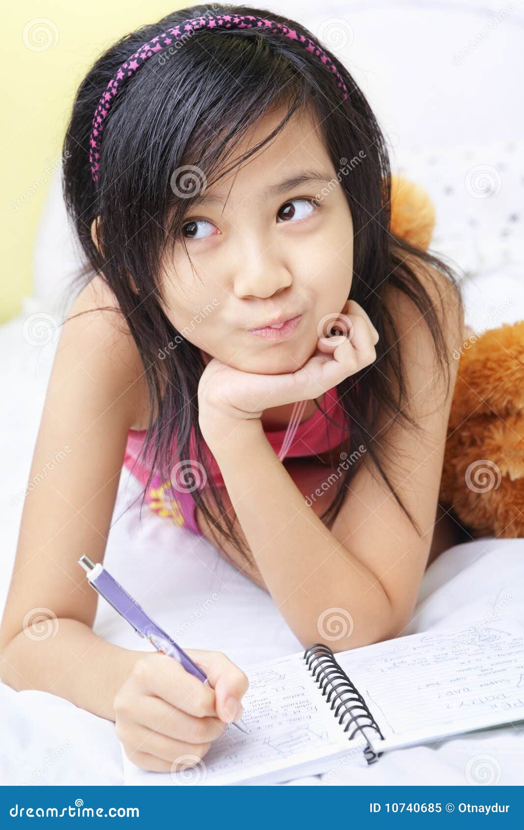 little girl writing her diary