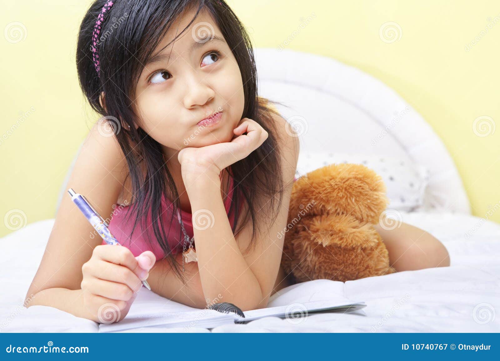 little girl writing her diary