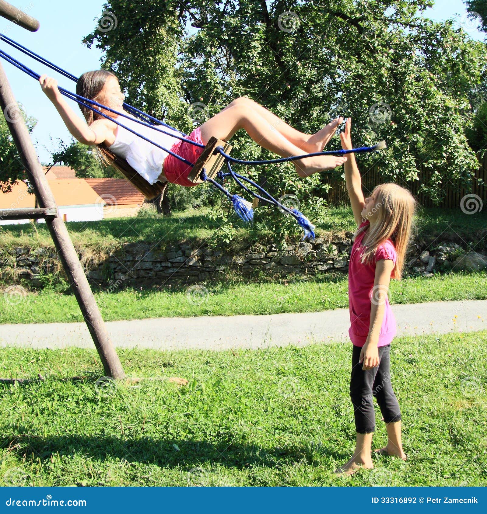 https://thumbs.dreamstime.com/z/little-girls-playing-swing-barefoot-girl-white-t-shirt-pink-shorts-swinging-second-girl-standing-33316892.jpg