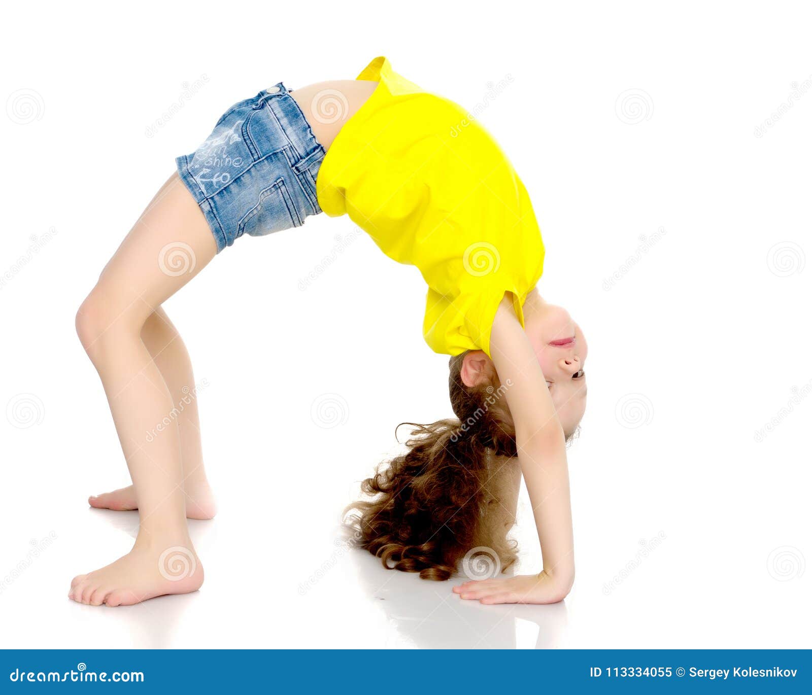 The Little Gymnast Performs a Bridge. Stock Image - Image of background ...