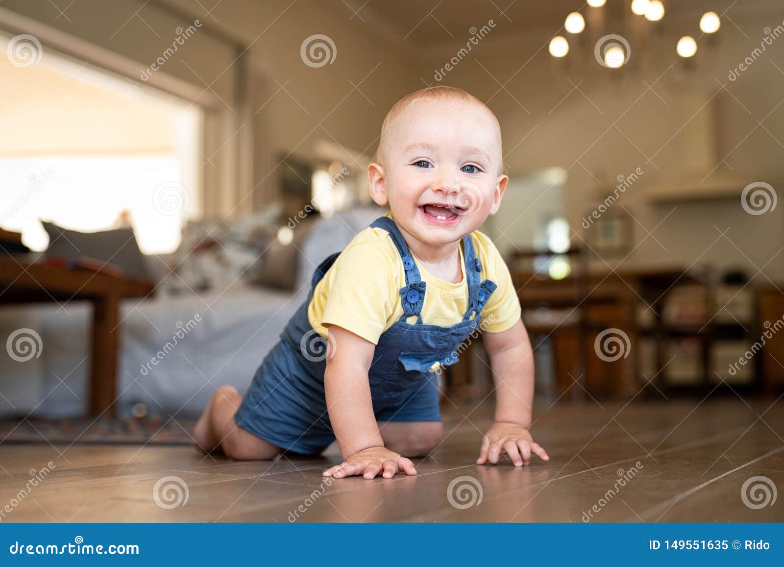 little happy boy crawling on floor