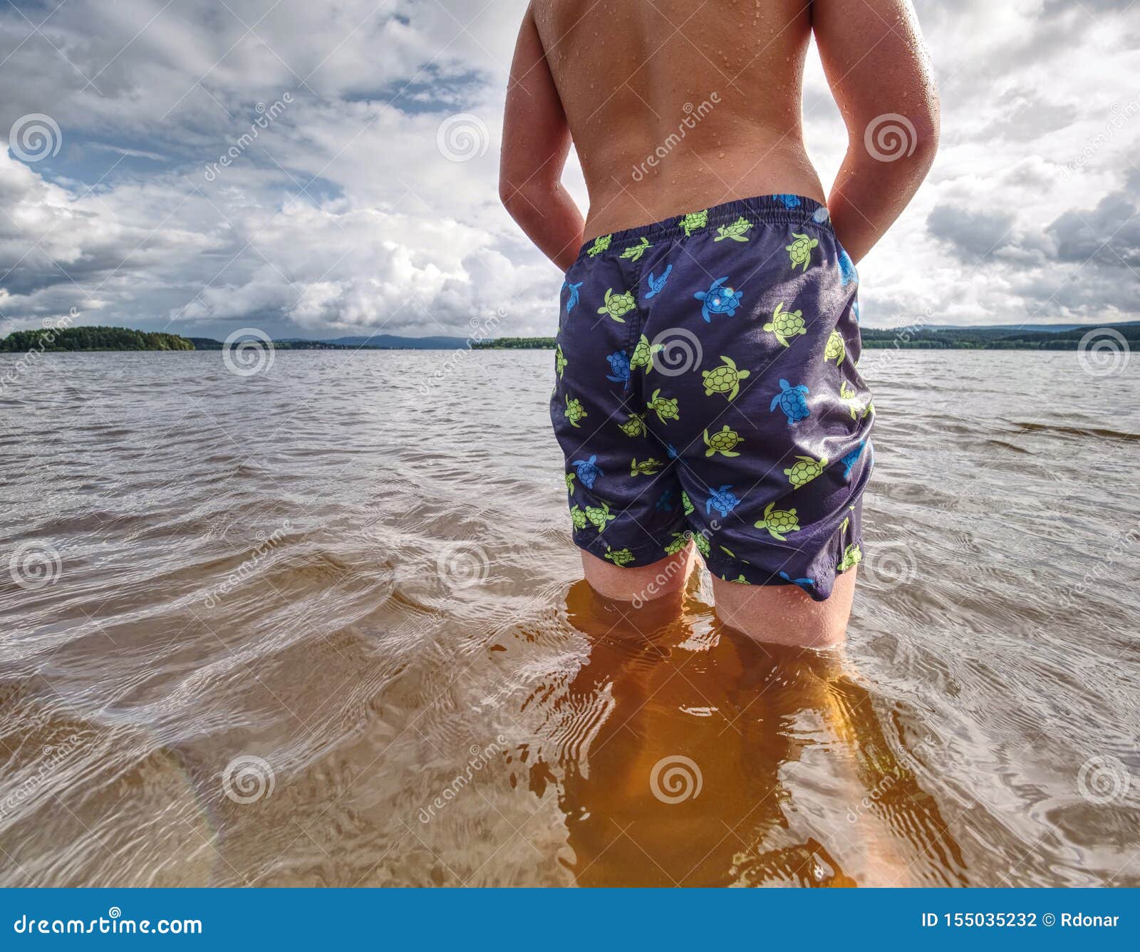 Little Joyful Caucasian Funny Boy Try Cold Water of Lake Stock Photo -  Image of shorts, scenic: 155035232