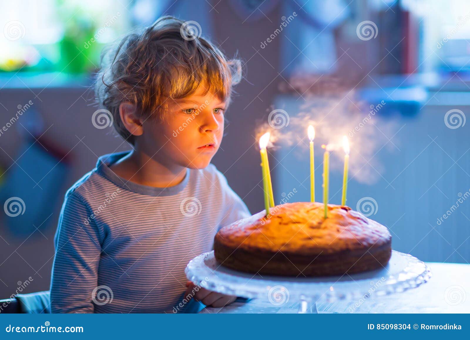 Little Kid Boy Celebrating His Birthday and Blowing Candles on Cake ...