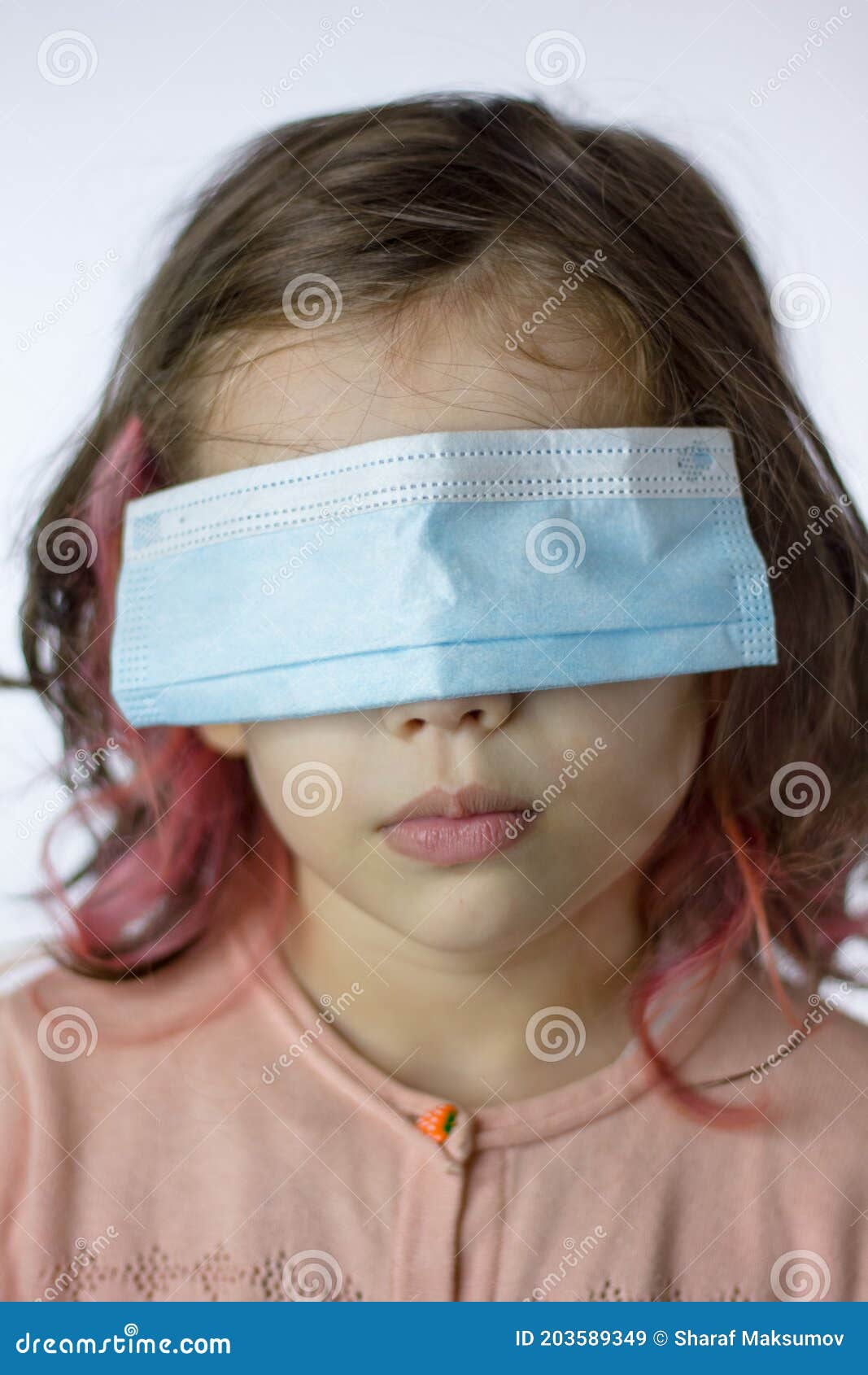 little kid girl with the eyes closed by mask during coronavirus epidemy