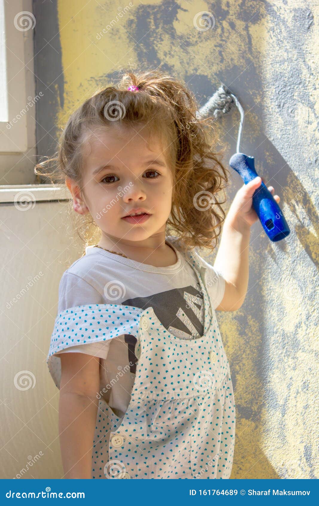 Little Kid Girl Paints Wall by Paint Roller Stock Image Image of room