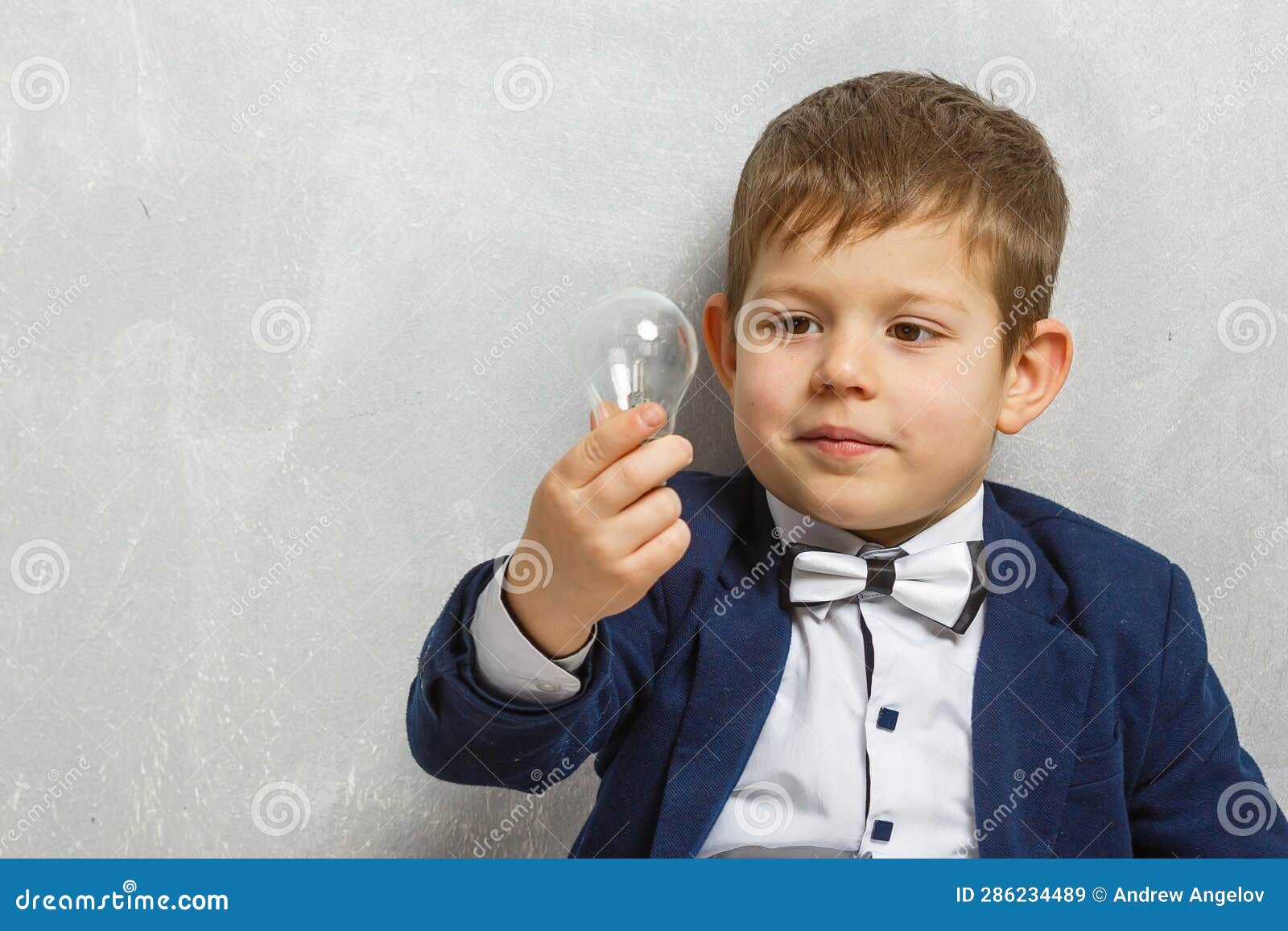 Little Kid Holding a Lightbulb Stock Image Image of childhood