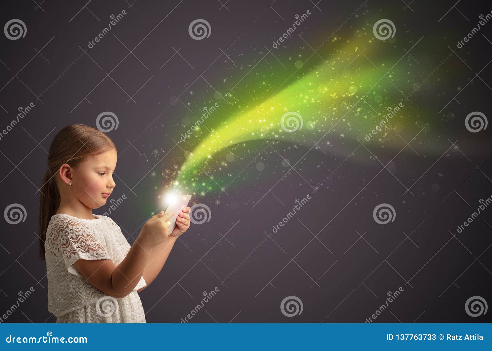 little kid playing on sparkling tablet