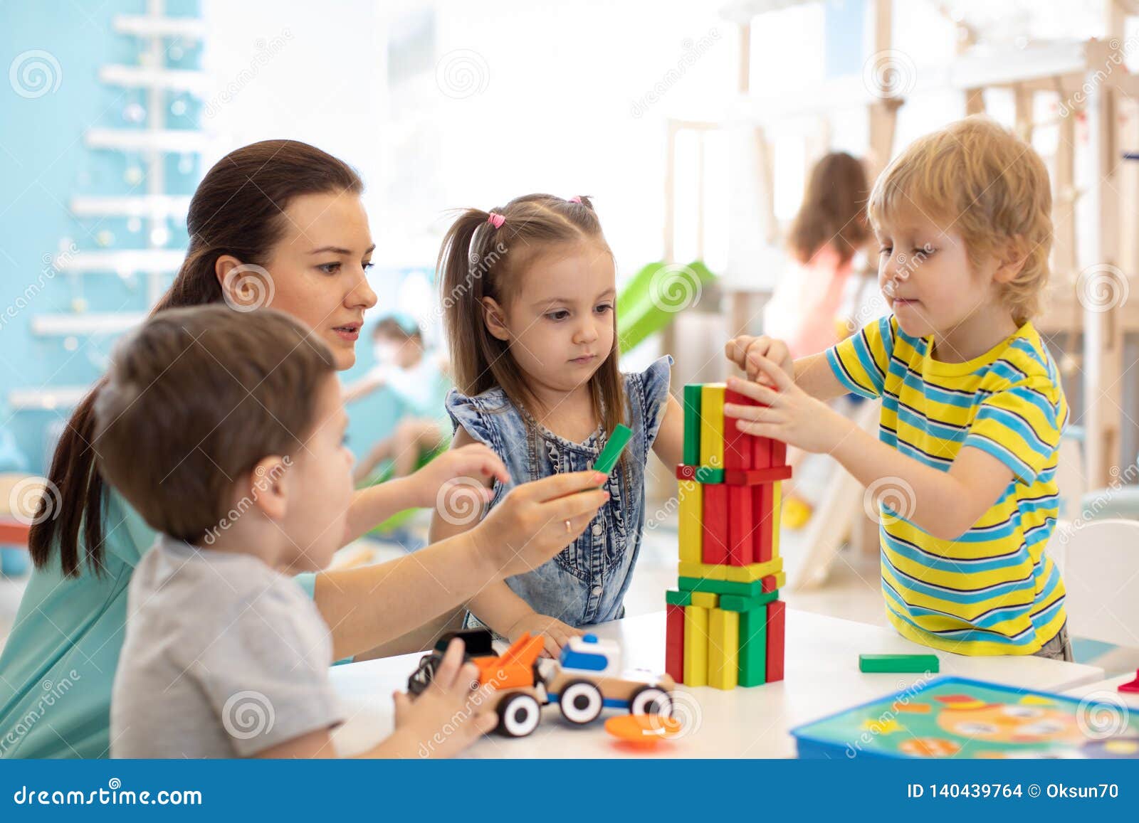 little kids build block toys at home or daycare. kids playing with color blocks. educational toys for preschool and kindergarten