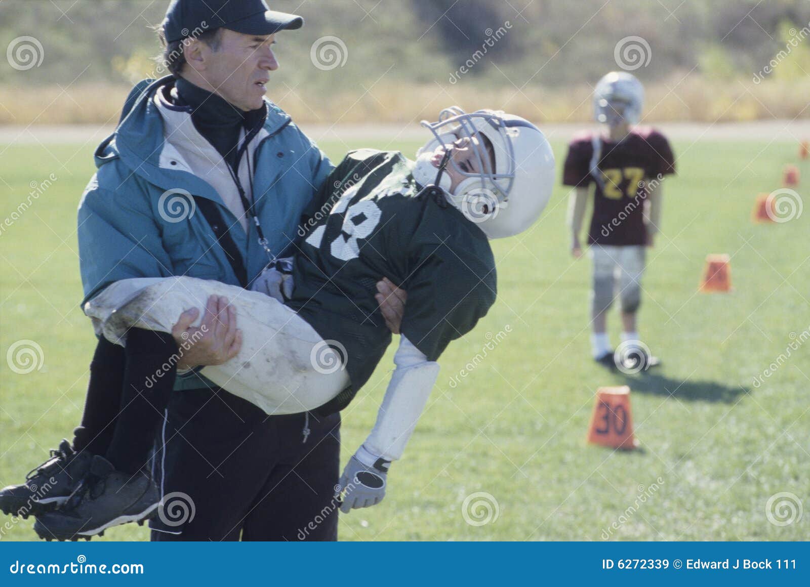 Little League Coach with Injured Football Player Stock Image - Image of  junior, lifting: 6272339