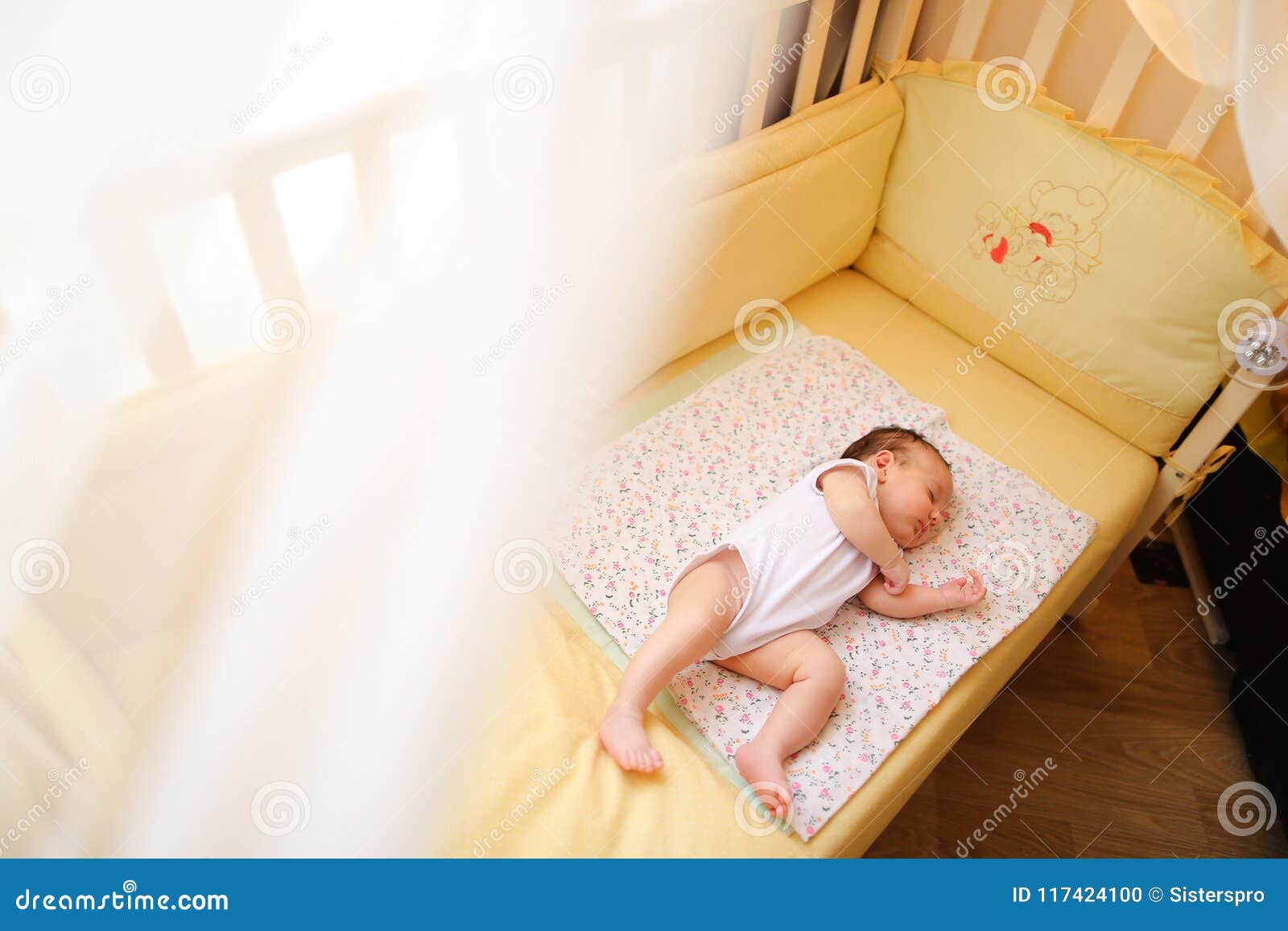 newborn sleeping in crib