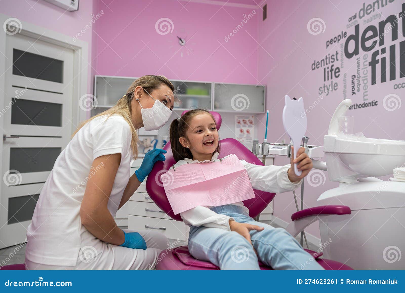Little Patient Admires Her Healthy Teeth in the Reflected Mirrors