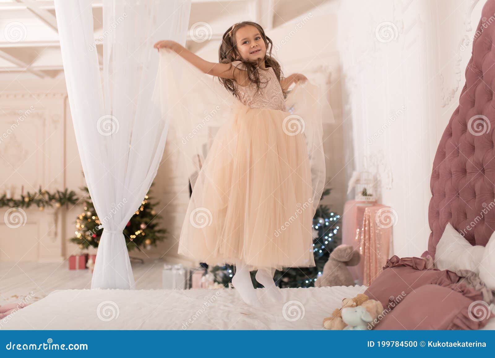The Little Princess is Jumping on the Bed Stock Photo Image of dress