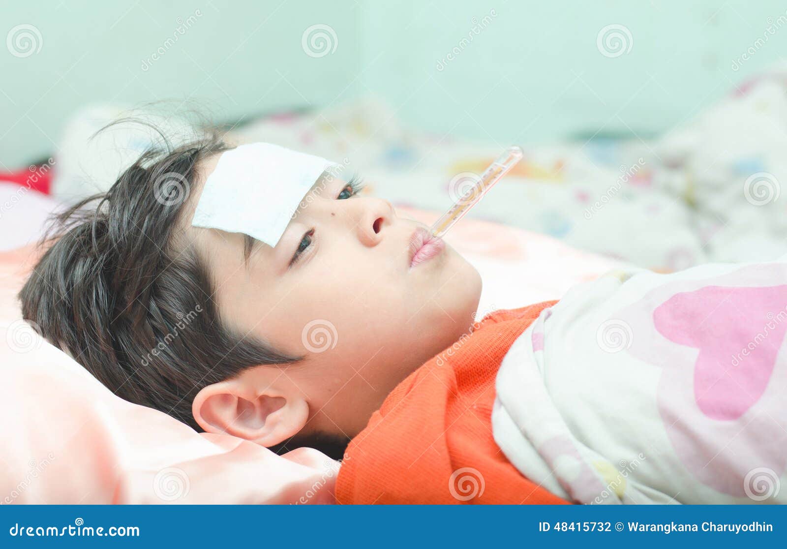 Little Sick Boy with Temperature Thermometer in Mouth Stock Photo