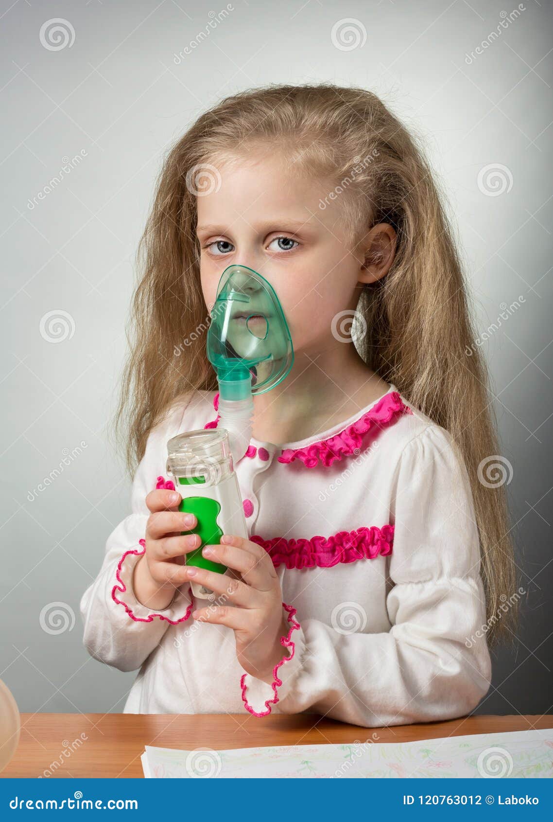 Little Sick Girl Breathing Using Nebulizer, on Gray Stock Photo Image of illness, childhood