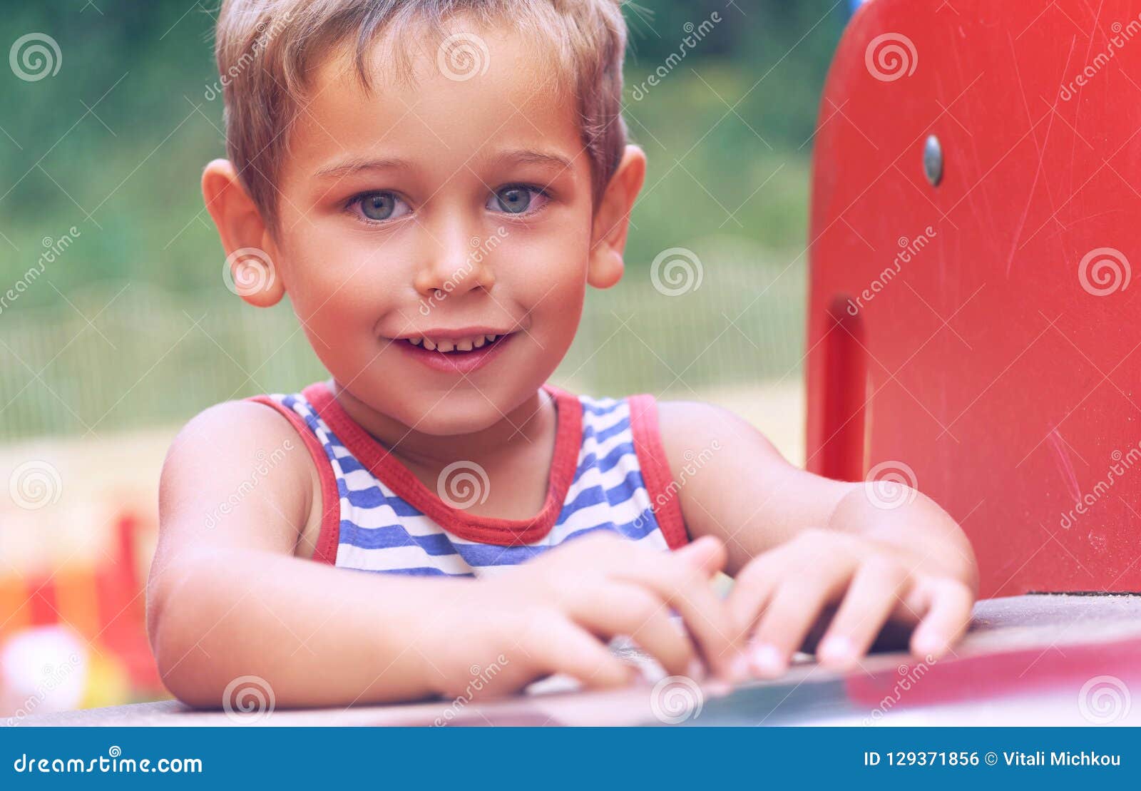 Little Toddler Boy in Striped T-shirt Having Fun on Playground on ...