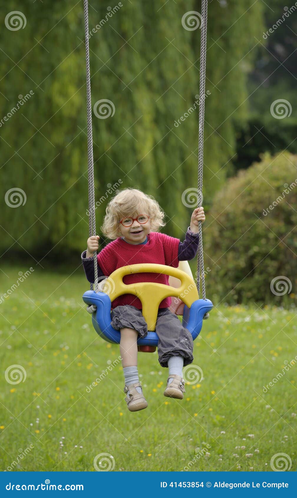 Little toddler on a swing,outdoors