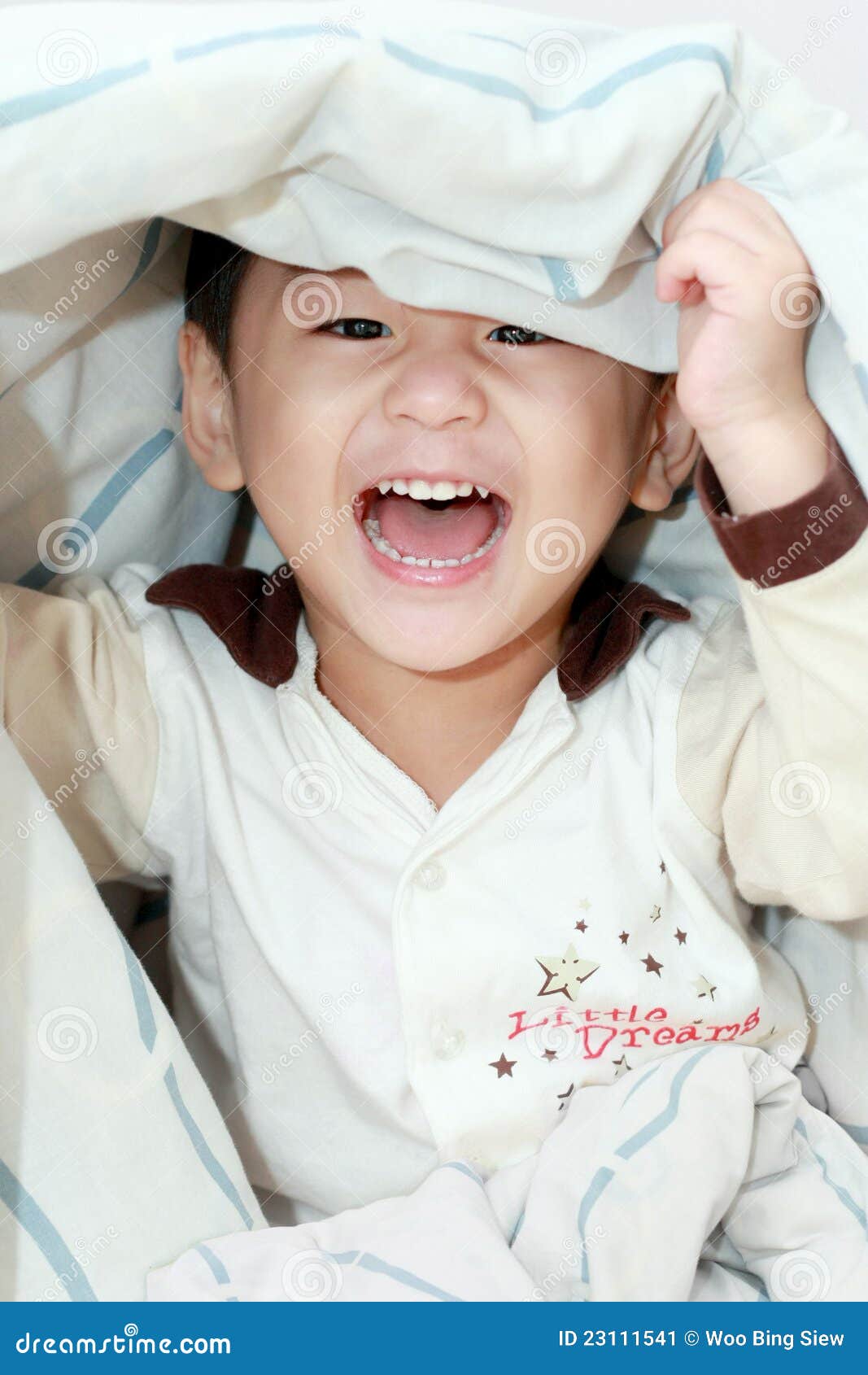 lively asian boy laughing