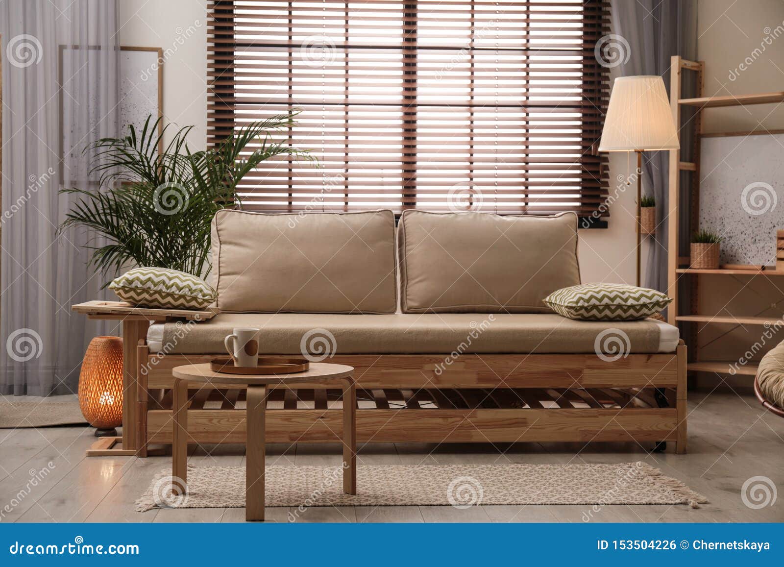 living room interior with sofa, window blinds and decor s