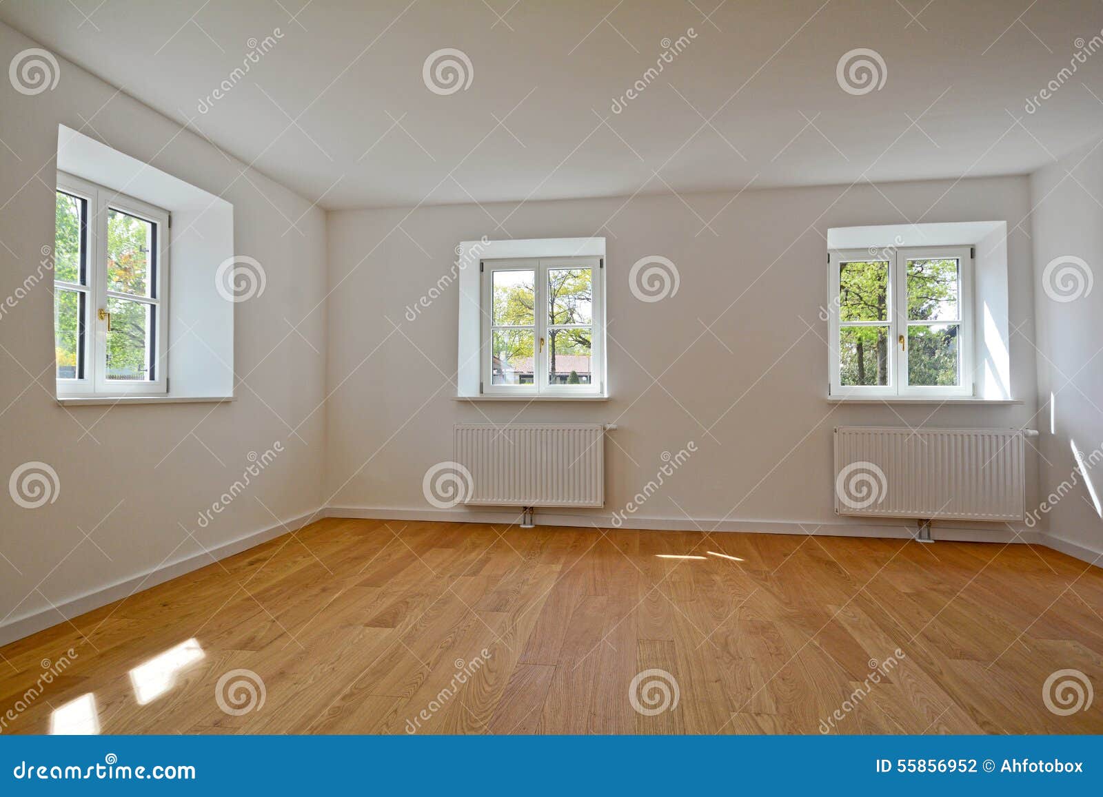 living room in an old building - apartment with wooden windows and parquet flooring after renovation