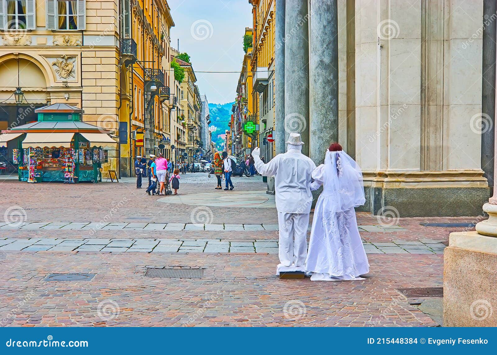 the living statue of bride and groom in piazza san carlo square, turin, italy
