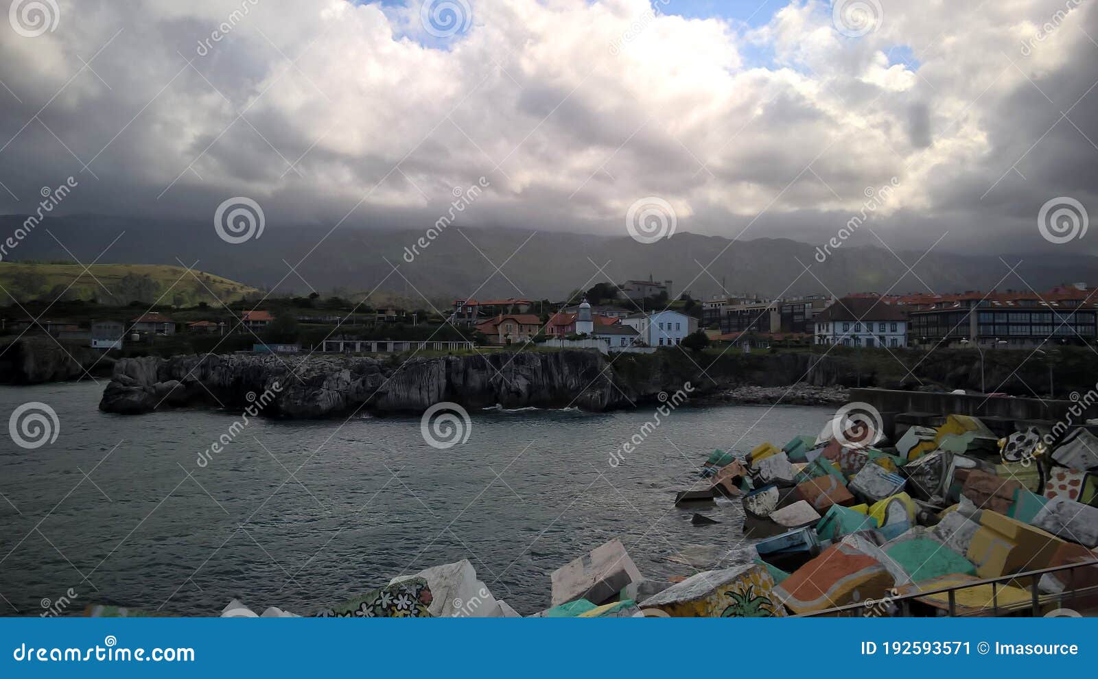 llanes seaport with cliffs and lighthouse - 2