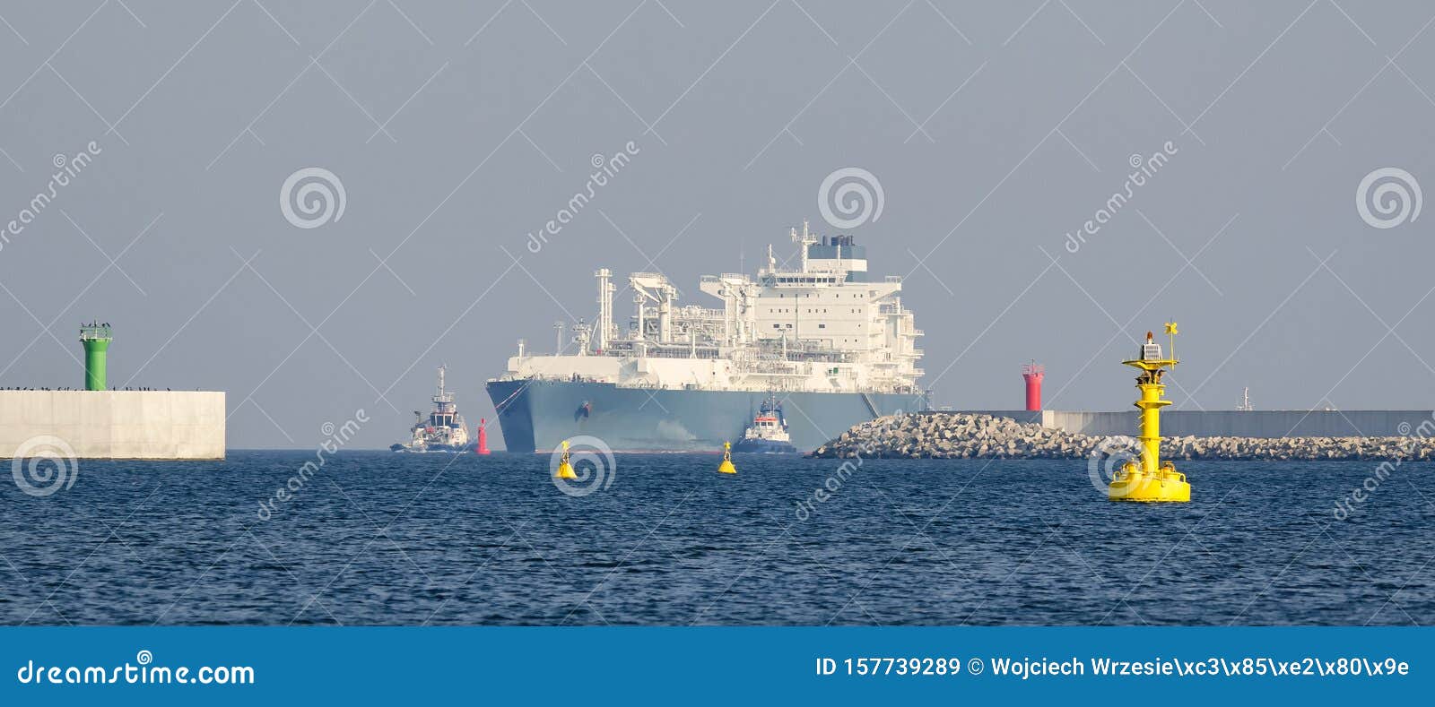 lng tanker and yellow navigation sign
