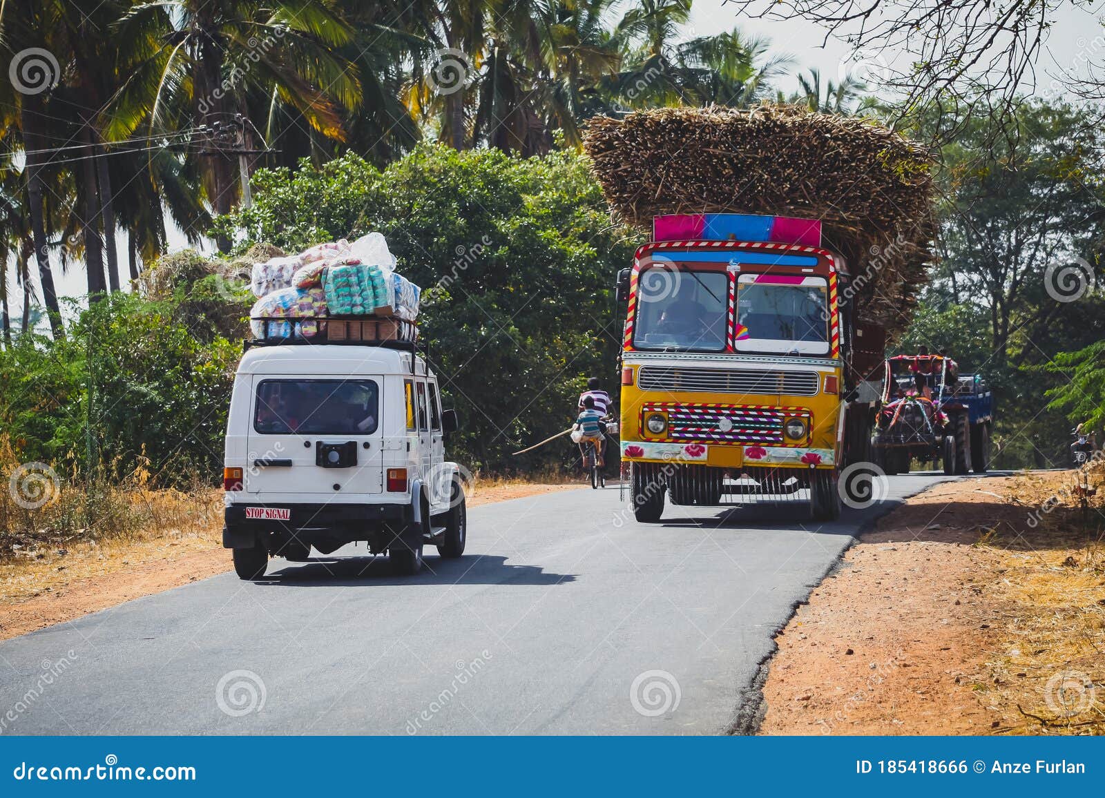 Stock photo of Typical rural transport, overloaded van with people,  Maharashtra, India. Available for sale on